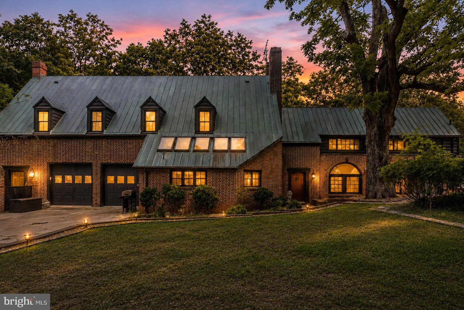 A truly rare opportunity to own one of the area's most distinctive estates. Situated on approximately 3 private acres, this remarkable Tidewater Vernacular Revival residence offers nearly 6,000 square feet of living space with 7 bedrooms, 6 full bathrooms, and 1 half bath, delivering an unmatched combination of historic character, modern comfort, exceptional craftsmanship, and income-producing potential.
Currently operated as a successful multi-unit Airbnb with three private guest suites and a separate main residence, the property provides incredible flexibility for a variety of lifestyles and investment goals. Continue operating as a short-term rental, create a multigenerational compound, enjoy a primary residence with supplemental rental income, or utilize as a single grand estate.
Steeped in local history, the home's exact age remains unknown after county records were lost in a courthouse fire, but local historians believe it may have been built by John Bancroft. Expert brick masons have noted that the home's distinctive brickwork predates 1900. Built to an extraordinary standard rarely seen today, the structure features over 20-inch-thick brick walls, concrete-supported floors reinforced by riveted steel beams, and a legendary 100-year copper roof. The result is a residence that feels more like a fortress than a traditional home.
Since purchasing the property in 2018, the current owners have invested extensively in updating, improving, and maintaining the home while preserving its historic integrity and architectural significance. The result is a property that seamlessly blends timeless craftsmanship with the conveniences expected by today's homeowners and guests.
The expansive main kitchen is designed for both everyday living and entertaining, featuring a Thermador six-burner gas range with integrated grill, farmhouse sink, bar sink, abundant workspace, and generous storage.
The owner's suite is a private retreat featuring a wood-burning fireplace and a secure three-point locking exterior door that opens to an industrial-style metal exit staircase. A second wood-burning stove adds warmth and character to the lower level.
The property offers an abundance of unique amenities seldom found in a single residence, including a secured concrete panic room with steel door, lock guards, and keypad access; a whole-house alarm system with independent controls for each living area; app-based monitoring capabilities; and exterior camera systems covering the garage and rear grounds.
Storage is exceptional throughout. A massive fully floored attic spans nearly the entire upper level and breezeway, providing an enormous amount of easily accessible storage space. The two-car garage includes built-in shelving, while the home's versatile layout accommodates everything from a home gym to hobby spaces and work-from-home needs.
Natural light floods the upper and lower breezeways, where walls of windows frame beautiful views and create inviting transitional spaces. Outside, landscaped stone pathways meander throughout the grounds, leading to a fenced garden area, a fully functional chicken coop, and numerous opportunities for expansion. With ample acreage available, there is room to add a pool, detached workshop, guest cottages, recreational amenities, or additional outdoor living spaces. Boating enthusiasts will appreciate the property's proximity to a local marina just minutes away, offering deep-water slips and convenient access for spending unforgettable days cruising, fishing, and exploring the river.
Properties offering this level of history, versatility, privacy, security, and income potential are exceptionally difficult to find. Whether you're seeking a landmark residence, a multigenerational family compound, a hospitality investment, or a combination of all three, this one-of-a-kind estate presents an opportunity unlike any other. Please no driveby's as there are guests at times.