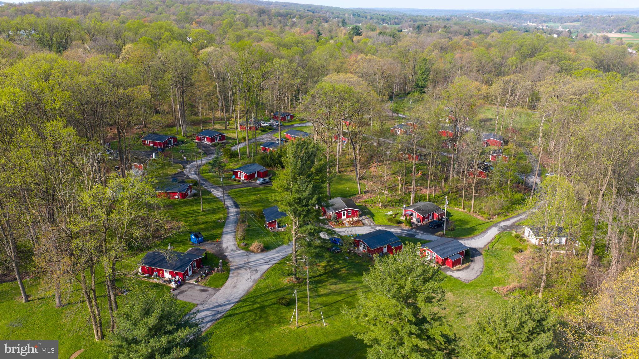 Location, Location, Location. 29.9 acres in Paradise Twp, Lancaster County with 30 cabins on long term rentals, short term rentals in the past (however confirm with township), pond and woodland with lots of potential. Good solid investment, tenant occupied.