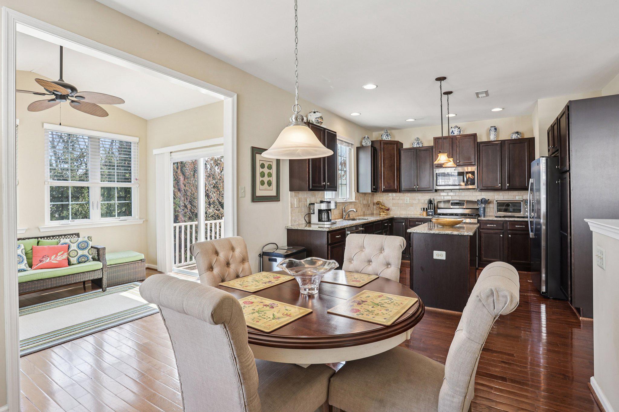 Spacious townhome in Lansdale’s, Williamson Square Community in the North Penn School District.  Built in 2013, this rare three-story end-unit offers a larger floor plan than its neighbors, and is flooded with natural light from three sides. Walk through the private side entrance into a versatile lower level. This expansive space—perfect for a home office or media room—leads directly to your quiet lower-level patio. You'll also find interior access to a spacious two-car garage, complete with custom shelving included in the sale. The second floor is the heart of the home. The open-concept design seamlessly connects a sunny living room with a cozy gas fireplace to the gourmet kitchen. Home chefs will love the granite countertops, striking wood cabinetry, and center island. Enjoy morning coffee in the breakfast nook or the adjacent sunroom, which offers views of 4th Street Park. Step through the sliding-glass door onto your private 10’ x 12’ deck for seamless indoor-outdoor entertaining. Upstairs, the primary suite features a large walk-in closet and a spacious bath with double sink vanities and a large stall shower. Two additional bright bedrooms, a center-hall full bath with a tub, and a dedicated laundry area complete this level.  It doesn't get better than this. A walkable location, neighborhood sidewalks, adjacent to the 4th Street Park, less than a mile from the dining, and shops of Main Street, and the SEPTA station. Enjoy the local hotspots, Lansdale Farmers Market and active community events.