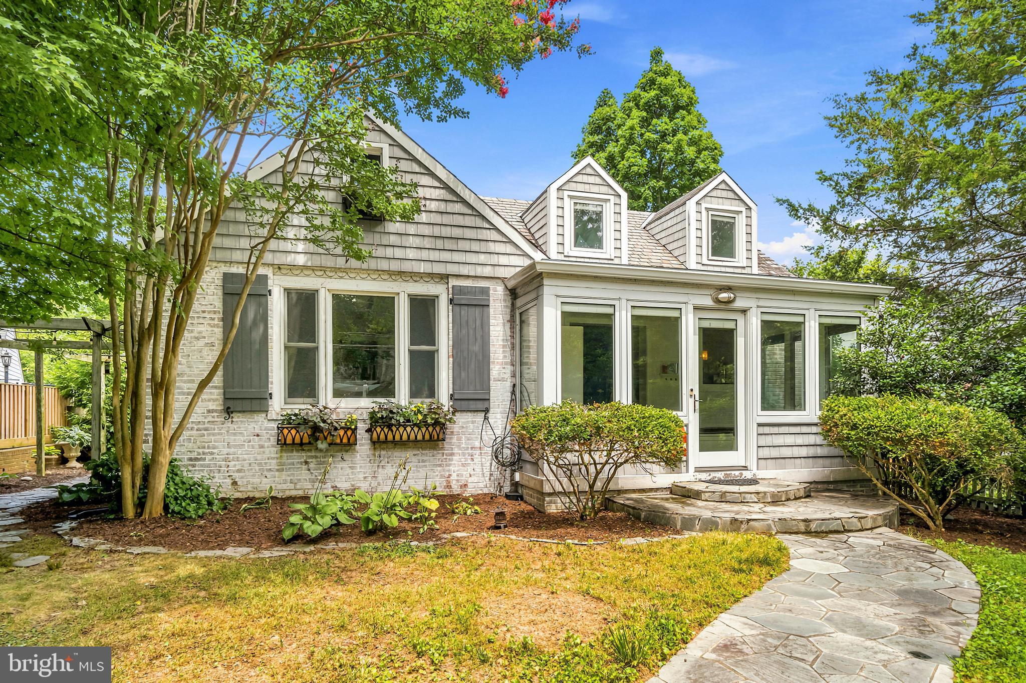 Sunlit Downtown Silver Spring Gem | Slate Roof, EV Charger & Endless Character! Welcome to 705 Bonifant St — classic architectural charm meets modern convenience in the heart of Downtown Silver Spring! Crowned by a timeless slate roof, this bright and airy 3-bedroom home offers a rare blend of character, flexible living spaces, and an unbeatable walkable location. Step into the home through a sun-drenched front sunroom, the perfect spot for morning coffee or a cozy reading nook. The welcoming main level flows naturally into a light-filled living room featuring a wood-burning fireplace, perfect for cool evening gatherings. To the right, the main-level kitchen offers great functionality with a convenient side door leading directly to the yard. The main floor also features two spacious, sunlit bedrooms and a full bathroom, offering the ease of true main-level living. Upstairs, you’ll find an open-concept top floor that serves as a flexible third bedroom, primary suite, or additional living space/home office, complete with its own half bathroom. Need room to expand or store? The unfinished basement offers great ceiling height and endless storage or potential for future customization. Outside, the elegantly manicured rear yard includes a detached 1-car garage, private parking, and a EV (electric vehicle) charger. All of this, just blocks from the Silver Spring Metro (Red Line/MARC), Whole Foods, AFI Theatre, local dining, and major commuter routes into Washington, D.C. Schedule your tour today and fall in love with the charm, light, and location! Mortgage savings may be available for buyers of this listing.
