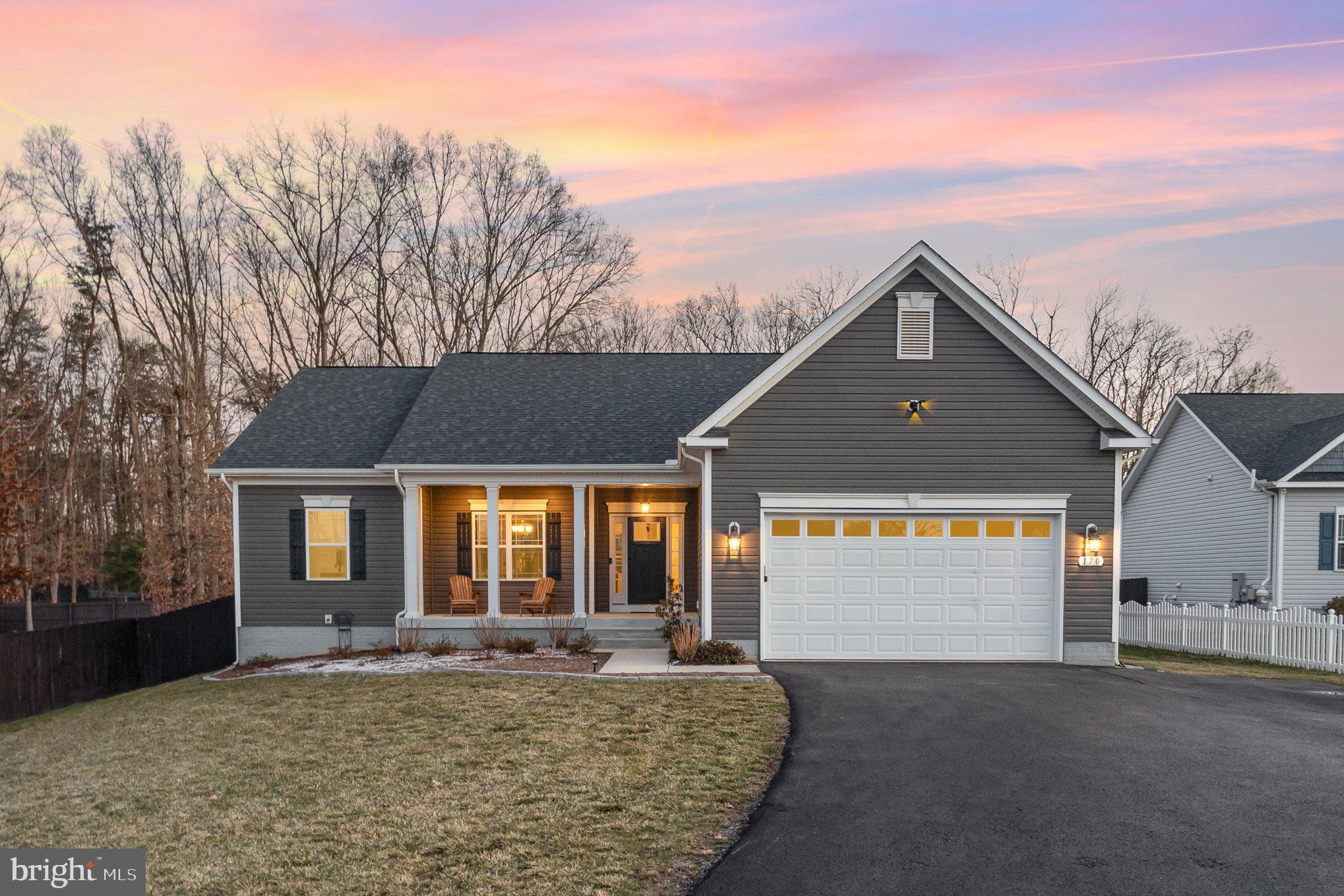 Welcome to your dream home! This charming ranch-style residence, built in 2019, offers a perfect blend of modern comfort and inviting warmth. With 1,716 square feet of thoughtfully designed living space, this home features three spacious bedrooms and two full bathrooms, including a luxurious primary bath with a soaking tub and stall shower. Step inside to discover an open floor plan that seamlessly connects the gourmet kitchen, complete with upgraded countertops, an island,  walk in pantry, and stainless-steel appliances, to the cozy dining and living areas. The elegant details, such as crown moldings, chair railings, and wainscoting, add a touch of sophistication, while the wood floors and plush carpeting create a welcoming atmosphere.  Transform the unfinished, roughed in, walkup basement  into your personal and functional space. The exterior of the home is equally impressive, featuring extensive hardscape, beautiful landscaping, and outdoor lighting that enhances the curb appeal. Enjoy your evenings on the deck or patios, perfect for entertaining or simply relaxing in your serene surroundings. The property sits on a generous 0.47-acre lot, providing ample space for outdoor activities. Convenience is key with an attached two-car garage, with multiple electrical outlets and work bench, it's perfect for a home workshop and DIY projects. Located within 5 miles of three  rail stations and close to downtown, this home offers easy access to transportation, shopping, and restaurants while maintaining a peaceful residential feel. Don’t miss the opportunity to make this beautiful property your own—schedule a tour today and experience the warmth and charm for yourself!
