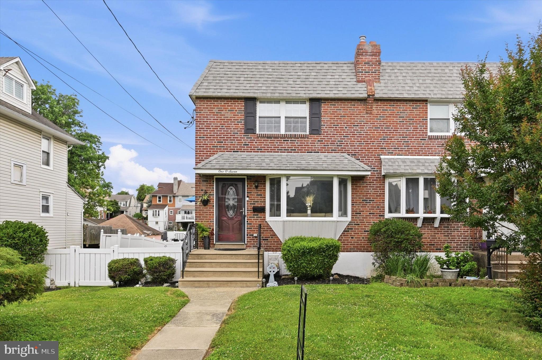 Welcome to 107 Mohawk Ave! This beautifully maintained twin home offers exceptional curb appeal and a warm, inviting atmosphere from the moment you arrive. Step inside to a spacious and comfortable first-floor layout filled with natural light and hardwood floors. The sun-drenched living room flows seamlessly into the dining room, with a convenient powder room nearby. The updated kitchen features ample cabinet space, modern appliances, and opens to a wonderful breakfast room addition (15' x 10'), creating the perfect gathering space for everyday living and entertaining. Upstairs, you'll find three generously sized bedrooms along with an updated hall bathroom. The finished lower level has been transformed into a cozy family room with a walkout to the backyard oasis. Outside, enjoy a fully fenced yard offering privacy and plenty of space to relax and entertain. Highlights include a beautiful, covered patio, an above-ground pool with sun deck, additional lawn space for games and activities, and a storage shed with electric service. There is off-street parking for 2–3 vehicles behind the home. Lovingly maintained and thoughtfully updated over the years, this home truly reflects pride in ownership throughout. Don't miss the opportunity to make this wonderful home your own!