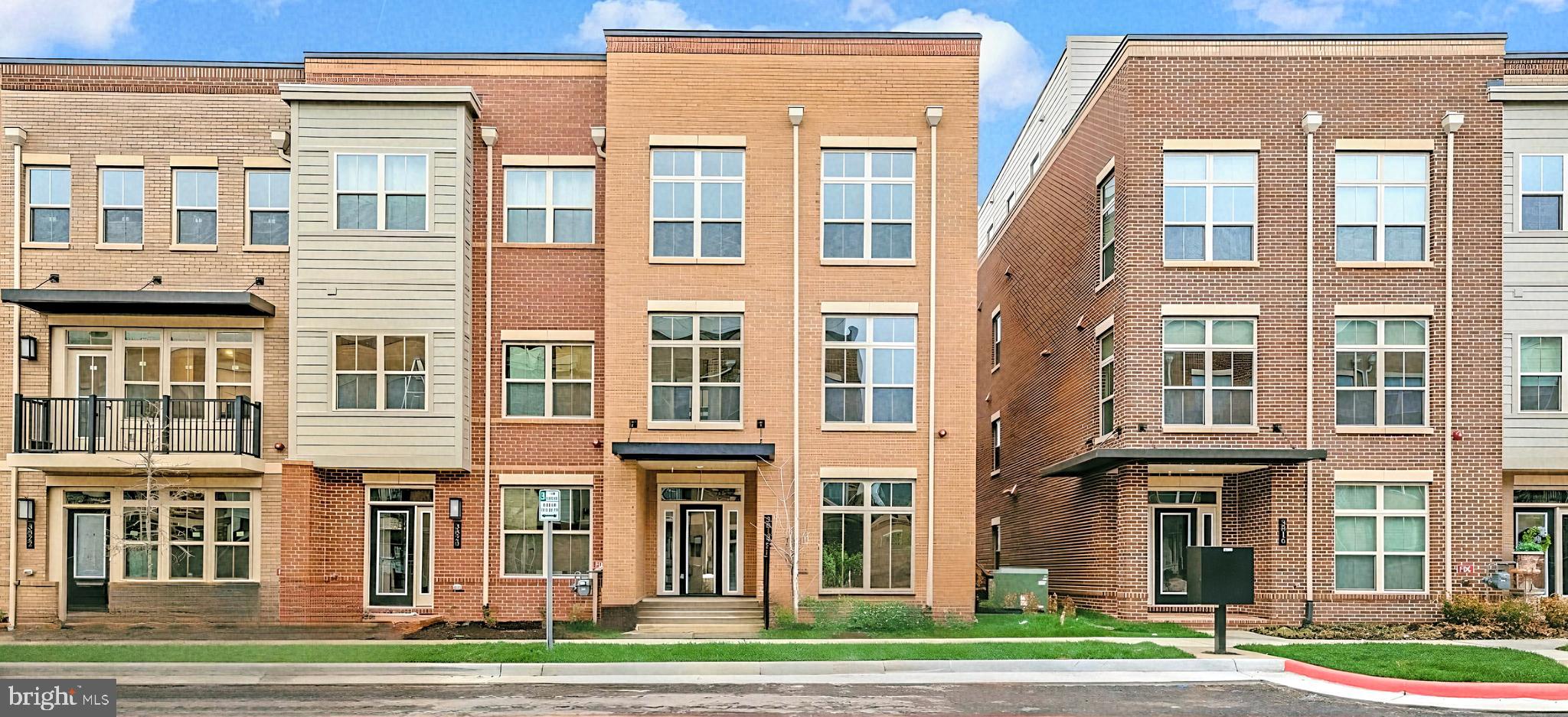 Brand new construction, without the wait! This neighborhood sold out quickly, and now you can immediately own an end-unit Johnston Urban 4-Level Townhome Model by NV Homes.  This home has $70k+ in upgraded options - from finishes to electrical items to structural choices like the built-in fireplace on the covered porch and the bedroom on the walk-in level.  This home has a perfect layout: 1 bedroom and full bath on the entry level, 3 bedrooms and 2 full bathrooms on the 3rd level, and a fifth bedroom on the 4th floor (in addition to the loft area).   Enjoy a wide-open floor plan on the kitchen level with tons of daylight, a covered porch, and a true chef's kitchen with white cabinets, quartz counters, and stainless appliances.  This is EASY living - with grocery stores, shopping and restaurants, and easy access to Rt 50 and 66, you can enjoy the energy of being in the heart of Fairfax and then return home to your bright new quiet home.  Enjoy abundant street parking for guests and a clean, finished 2-car garage.