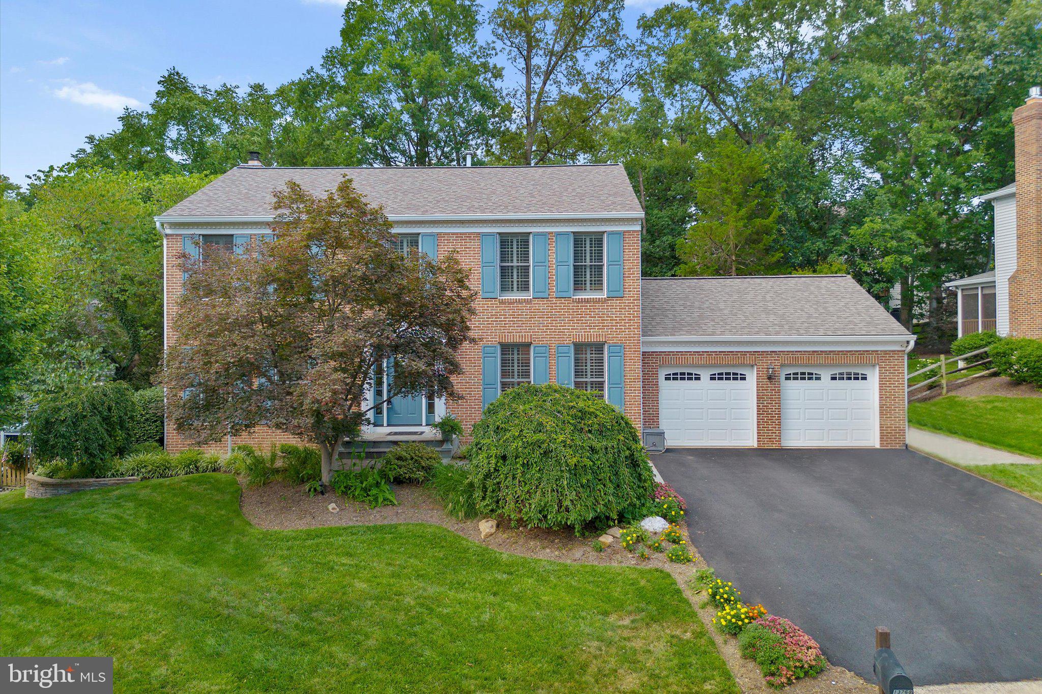 Welcome to 13768 Laurel Rock Drive, an elegant Colonial residence tucked away in the coveted Little Rocky Run community of Clifton, VA. This beautifully updated home offers timeless design, modern upgrades, and over 2,600 square feet of refined living space across three finished levels.

Sitting on a picturesque, tree-lined lot that backs to woods, this property offers the perfect blend of privacy and community living. The stately exterior, with its classic brick façade and manicured landscaping, sets the tone for the thoughtful design found within.

Inside, the main level features gleaming hardwood floors and a light-filled layout designed for both everyday comfort and upscale entertaining. A formal living and dining room provide classic charm, while the family room—with its cozy gas fireplace—flows effortlessly into the gourmet kitchen. Complete with stainless steel appliances, a six-burner range, upgraded countertops, and ample cabinetry, the kitchen is as functional as it is beautiful. Step outside from the dining area onto a spacious deck that overlooks the serene backyard—perfect for morning coffee or evening gatherings.

Upstairs, the primary suite is a true retreat, featuring a custom walk-in closet, and a fully remodeled spa-like bath with a double vanity, oversized shower, and modern finishes. Three additional bedrooms share a well-appointed hall bath.

The fully finished walk-out lower level offers incredible versatility with a large recreation room, and a half bath—ideal for hosting, working, or relaxing.

As part of the Little Rocky Run community, residents enjoy access to multiple pools, tennis courts, walking trails, and community centers. This home also offers convenient access to major commuter routes, schools, and the charming shops and restaurants of historic Clifton.

13768 Laurel Rock Drive is a rare opportunity to own a move-in ready home in one of Clifton’s most sought-after neighborhoods. Don’t miss the chance to make it yours.