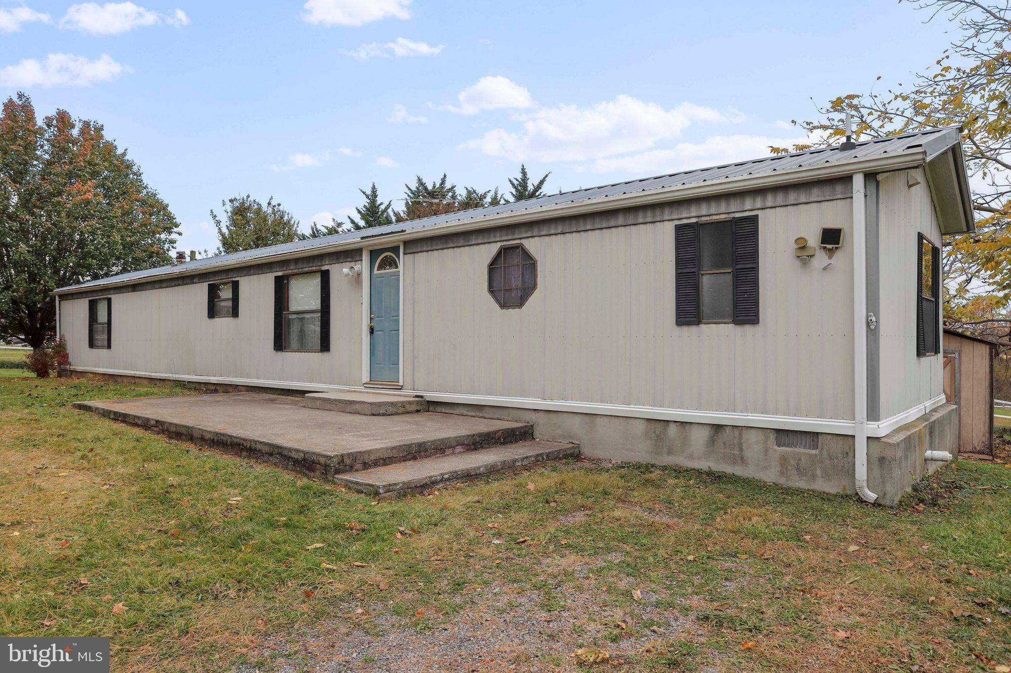 Nice 3 bedroom, 2 full bath single-wide mobile home located in rural Hancock. Situated on 1.26 acres. Traditional floor plan. Living room with built-in shelves. Eat-in kitchen with ample cabinetry and table space. Dining room with sliding glass doors to backyard deck. Primary bedroom with en suite. Central cooling and heating. Great one-level living in a countryside setting. Schedule your tour today!