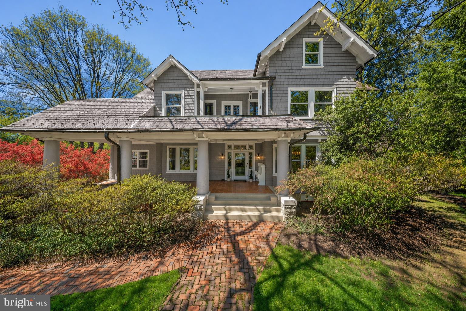 This Grand Dame enters a graceful new season with a meaningful $100,000 price refinement and an upcoming exterior transformation. Join us at Sunday’s Open House to view three thoughtfully curated paint palettes under consideration for her next chapter. This subtle refresh is designed to further accentuate the architectural beauty of 5 Chevy Chase Circle while honoring the timeless sophistication and commanding presence this beloved residence has long embodied.

Positioned prominently on the Circle, a gracious front porch sets the tone, leading to an elegant entryway with a welcoming vestibule that reflects the home’s comfortable yet sophisticated character. This substantial residence of approximately 7,000 square feet includes seven bedrooms, five full baths, and a powder room. 
The main level offers a beautifully flowing floor plan ideal for both everyday living and entertaining. A spacious entry hall provides access to multiple patios overlooking the pool, seamlessly connecting indoor and outdoor spaces. The living room accommodates multiple seating areas and is both grand and inviting, complemented by a wood-paneled study offering flexibility and charm. A formal dining room, enhanced by a butler’s pantry, creates a refined setting for gatherings, while a mudroom off the kitchen adds everyday convenience.
The eat-in kitchen is spacious and inviting, featuring a classic Aga stove, Sub-Zero refrigerator, and two Bosch dishwashers. Designed with both function and style in mind, it offers counter seating, a dedicated dining area, striking pendant lighting, Farrow & Ball wallpaper, and an adjoining butler’s pantry.
A large, light-filled sunroom with three exposures overlooks the pool and provides additional patio access, further enhancing the indoor-outdoor connection. Thoughtful details such as window seats and banquette seating add warmth and character throughout.
The primary suite features a fireplace, a light-filled ambiance, a dressing area, and a large cedar walk-in closet, along with an ensuite bath with dual sinks. An additional ensuite bedroom, two secondary bedrooms (one with an adjacent sitting room), and a hall bath complete the upper level. The third floor includes a spacious living area with built-in bookcases, three bedrooms, and a full bath.
The home’s layout includes generous landings, a back staircase, and flexible spaces well suited for home offices or in-law accommodations, offering versatility for a variety of lifestyles.
The private pool, surrounded by a brick patio, is complemented by a secluded side yard offering exceptional privacy and a tranquil setting. The grounds also feature additional outdoor space, brick pathways, and mature plantings, creating a lush, serene landscape. The lot spans approximately 14,904 square feet.
A detached two-car garage, lined with windows on three sides, is filled with natural light and equipped for an electric vehicle charger. The lower level features a sauna, creating a private retreat, along with ample storage.
An added distinction is the recently renovated fountain at Chevy Chase Circle—a beautifully restored centerpiece with a classic tiered design and enhanced landscaping.
Residents of Chevy Chase Village enjoy a unique level of service and convenience, including house checks, key-holding services, and package collection upon request, along with a variety of community programs and events. The home is just steps from shops and restaurants along Connecticut Avenue and within walking distance of Friendship Heights Metro and Wisconsin Place.
This residence is both a local landmark and a testament to enduring design. Its commanding presence on Chevy Chase Circle places it among the most recognizable homes in the village, surrounded by historic architecture, mature landscaping, and the timeless charm of one of the region’s most coveted addresses. 5 Chevy Chase Circle presents a rare opportunity to own a truly distinctive home in an exceptional location.