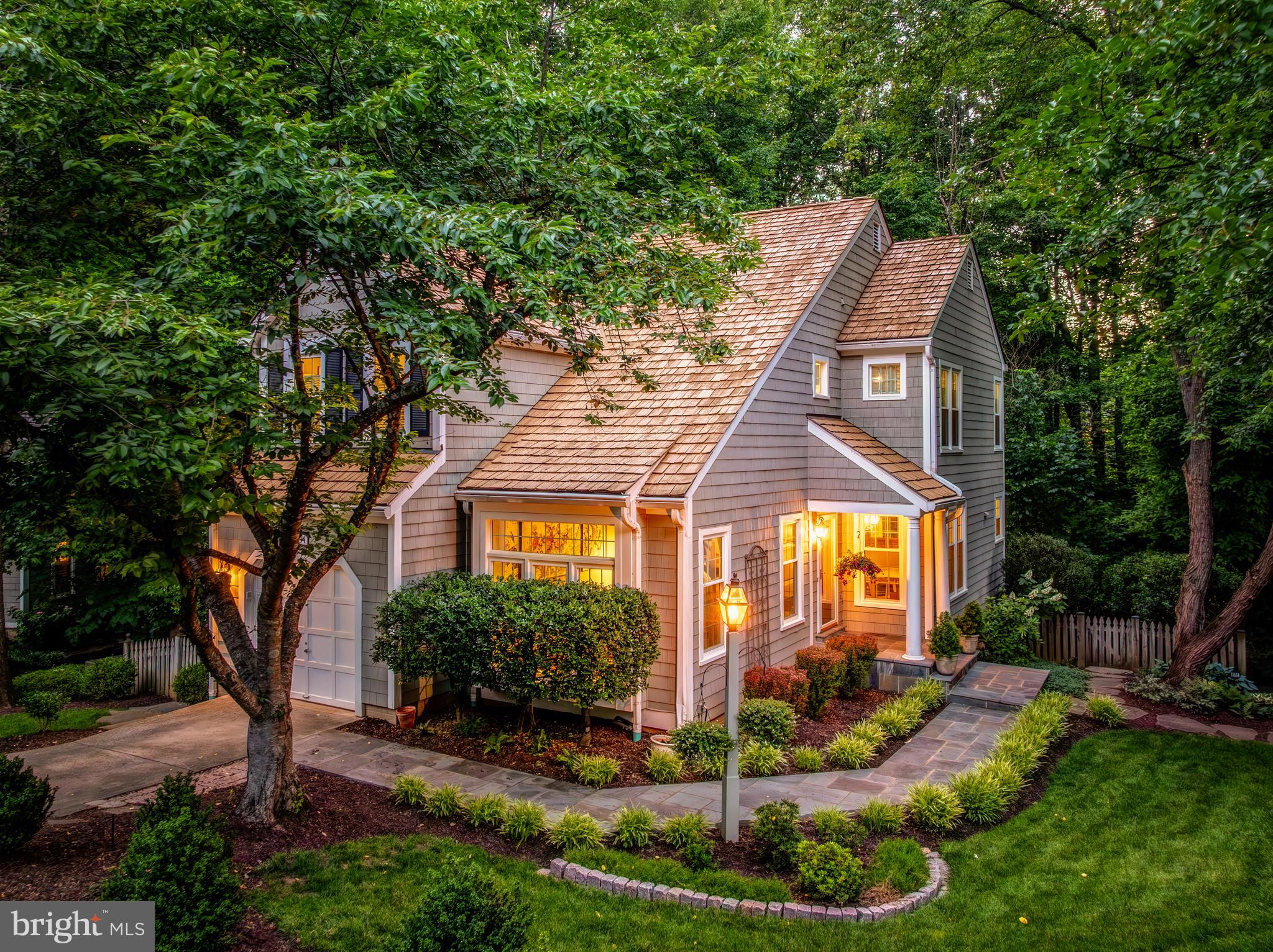 Tucked away at the end of a quiet cul-de-sac in North Reston, this four-bedroom, three-and-a-half-bath home is surrounded by mature trees and lush landscaping that create a sense of privacy year-round. Inside, cathedral ceilings, skylights, and walls of windows fill the home with natural light and enhance the open floor plan. The main level flows easily from the living room with soaring ceilings to the dining area, family room with fireplace, and an updated kitchen featuring 42-inch white cabinetry, granite countertops, stainless steel appliances, tile backsplash, recessed lighting, and a sunny bay window breakfast nook. Just off the family room, the deck overlooks a generously sized fenced backyard and a backdrop of trees, creating a setting that feels immersed in nature. Upstairs, the primary suite offers cathedral ceilings, two skylights, a walk-in closet, and a beautifully renovated bath with a white, dual trough sink vanity, freestanding soaking tub, large-format tile, full tile surround, and seamless glass shower. An equally impressive secondary bedroom features cathedral ceilings, two skylights, and a footprint comparable to the primary suite, while a third bedroom, full hall bath, and conveniently located upper-level laundry room complete the floor. The walkout lower level includes a spacious recreation room with recessed lighting and French doors leading to the patio, a legal fourth bedroom, full bath, abundant storage, and flexible space for guests, work, or hobbies. Since 2019, the owners have replaced all windows, renovated the primary bath and main-level powder room, added a flagstone front walkway, installed deck stairs to the backyard, and completed fresh interior paint and new carpet throughout in 2026. Just one block from North Point Village Center, residents can walk to grocery shopping, restaurants, coffee shops, and everyday conveniences, as well as Reston's pools, tennis courts, parks, tot lots, picnic areas, and miles of scenic trails. Reston Town Center is just minutes away, the Metro is less than three miles from the home, and Route 7, the Dulles Toll Road, and the Greenway are all easily accessible. As part of Reston Association, residents enjoy access to 15 pools, 55 miles of trails, numerous parks, 4 beautiful lakes, 52 tennis courts, 18 pickle ball courts, a variety of community events and programs throughout the year including festivals, concerts, workshops, and social gatherings, plus several community centers including the Reston Association headquarters, Walker Nature Center, and the Lake House at Lake Newport, which offer space for meetings, classes, and special events.