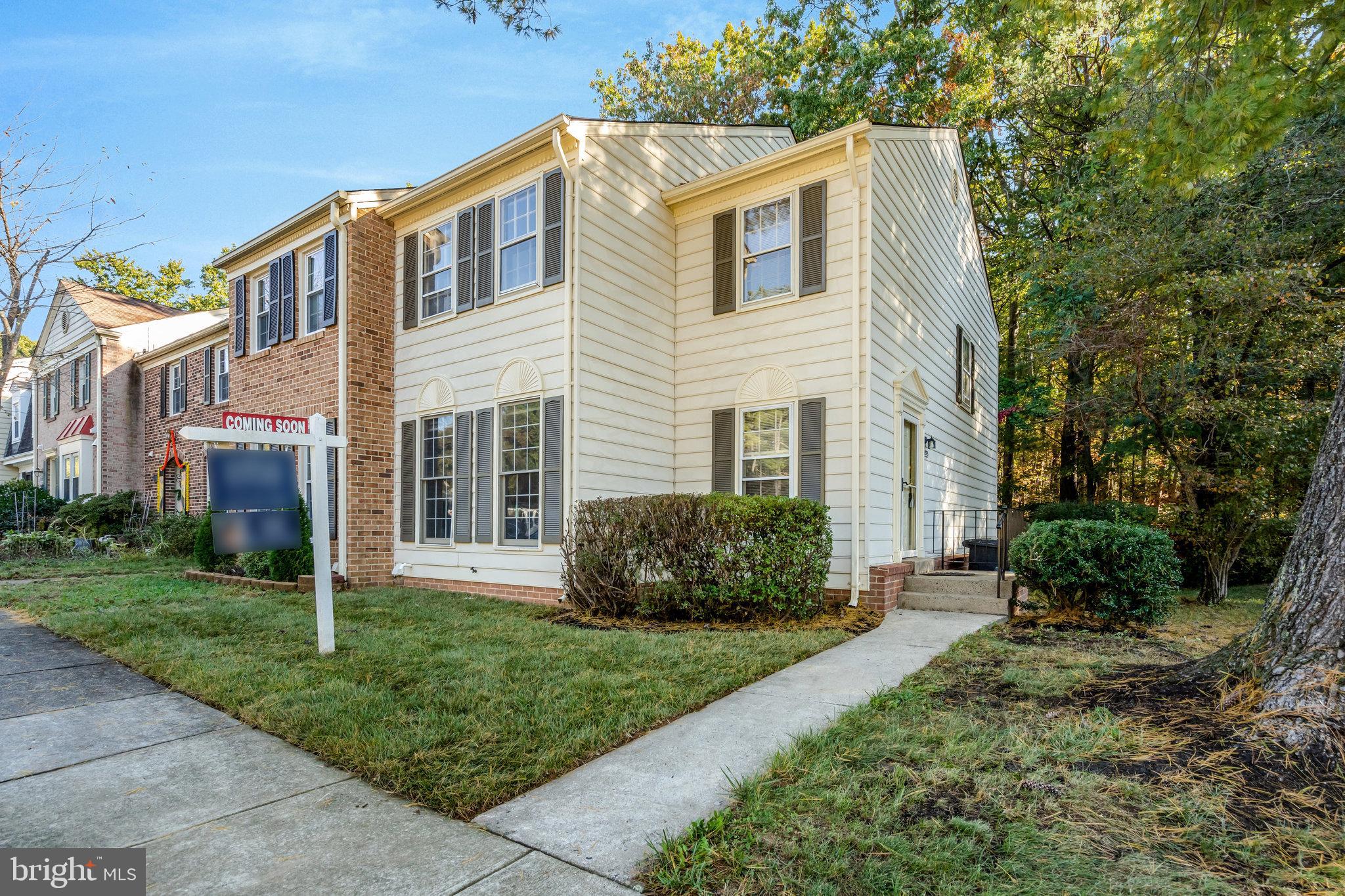 Fantastic location! End-unit townhome with over 2,200 sq ft of finished space. The fenced rear yard features a custom-designed paver patio with a serene setting backing to trees. Inside, you'll find high-quality upgrades like hardwood flooring on the main and upper levels, a kitchen with a spacious island, granite countertops, stainless steel appliances, a wine cooler, built-in cabinets in the dining area, a large pantry, under-cabinet lighting, and more. The upper level includes a primary bedroom with a dressing area and a spacious upgraded bath with a walk-in shower and double showerheads, along with two additional bedrooms and a hall bath. The lower level offers a large family room with a wood-burning fireplace, a bonus room, a full bath, and a generous storage/laundry/utility room with built-in cabinets and a granite countertop. Freshly painted and move-in ready, this home is conveniently located near Burke Station VRE, shopping, and dining.