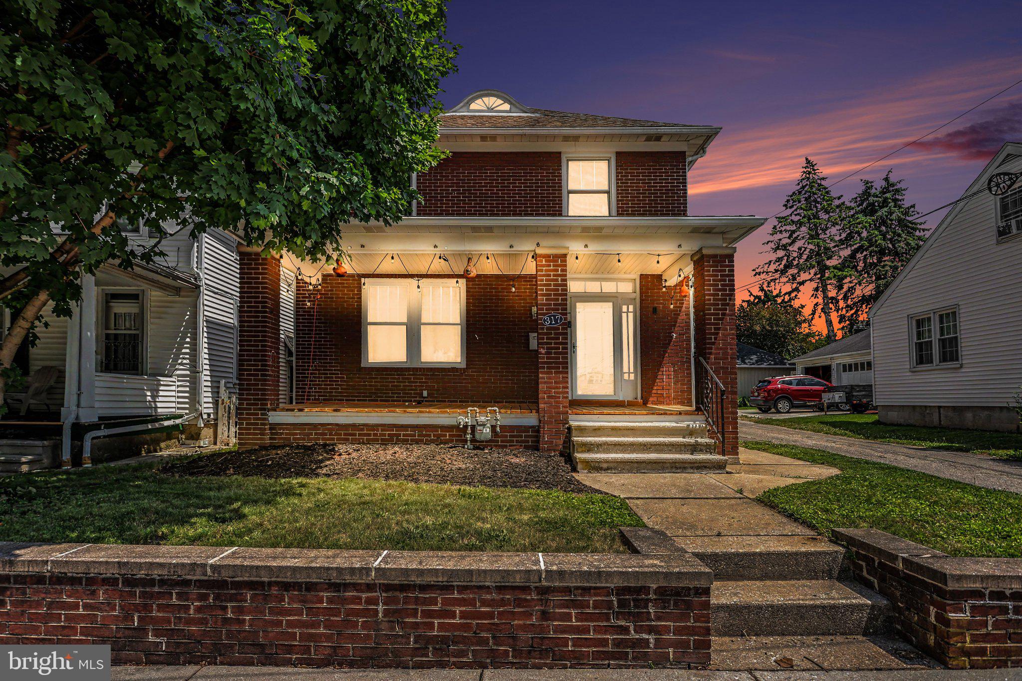 Coming Soon! Full of character and timeless charm, this 3-bedroom 2 Full Bath Hanover home offers a wonderful opportunity for its next owner to update and personalize while preserving its unique architectural details. From the moment you arrive, you'll appreciate the classic features that are difficult to find in today's homes, including decorative transoms, rich wood trim, graceful archways, glass doorknobs, and hardwood flooring throughout much of the home.  The kitchen opens to the dining area and features a center island with breakfast bar seating, a farmhouse sink, and direct access to the enclosed porch and backyard beyond. Outside, you'll find a patio area perfect for relaxing, outdoor dining, or entertaining family and friends.  Upstairs, three generously sized bedrooms are complemented by a versatile bonus room that could serve as a home office, playroom, hobby space, or potential fourth bedroom. A private balcony accessed from one of the bedrooms overlooks the backyard and provides a peaceful spot to unwind at the end of the day.  Additional highlights include a one-car carport, detached garage, and convenient alley access. Lovingly maintained over the years, this home offers classic character, flexible living space, and endless potential for its next chapter.