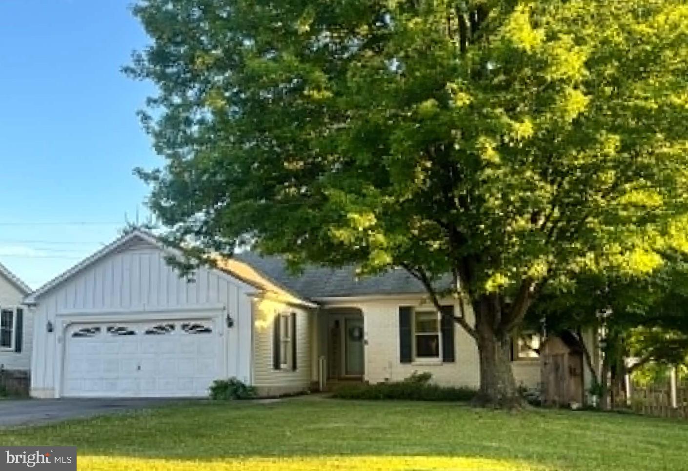 This well-maintained ranch home offers the ease of one-level living with 3 bedrooms, 2 full baths, and a layout that is both comfortable and functional. 

Inside, you'll find LVP flooring, built-in cabinetry, and a wood-burning fireplace with a metal liner that adds warmth and character to the living space. The kitchen and living area open to a large deck overlooking the backyard, creating the perfect spot for morning coffee, outdoor dining, or simply enjoying the peaceful surroundings.

The walk-out lower level provides additional living space with a spacious family room, playroom, laundry room, and an abundance of storage. Step outside to the brick patio and enjoy the large, shaded, fenced backyard that offers plenty of room to relax, entertain, garden, or play.

Situated on a .22-acre lot, this home combines the convenience of neighborhood living with beautiful mountain and farmland views. Additional features include 200-amp electrical service, an architectural shingle roof approximately 8 years old, a hot water heater replaced in 2019, and ample storage throughout.