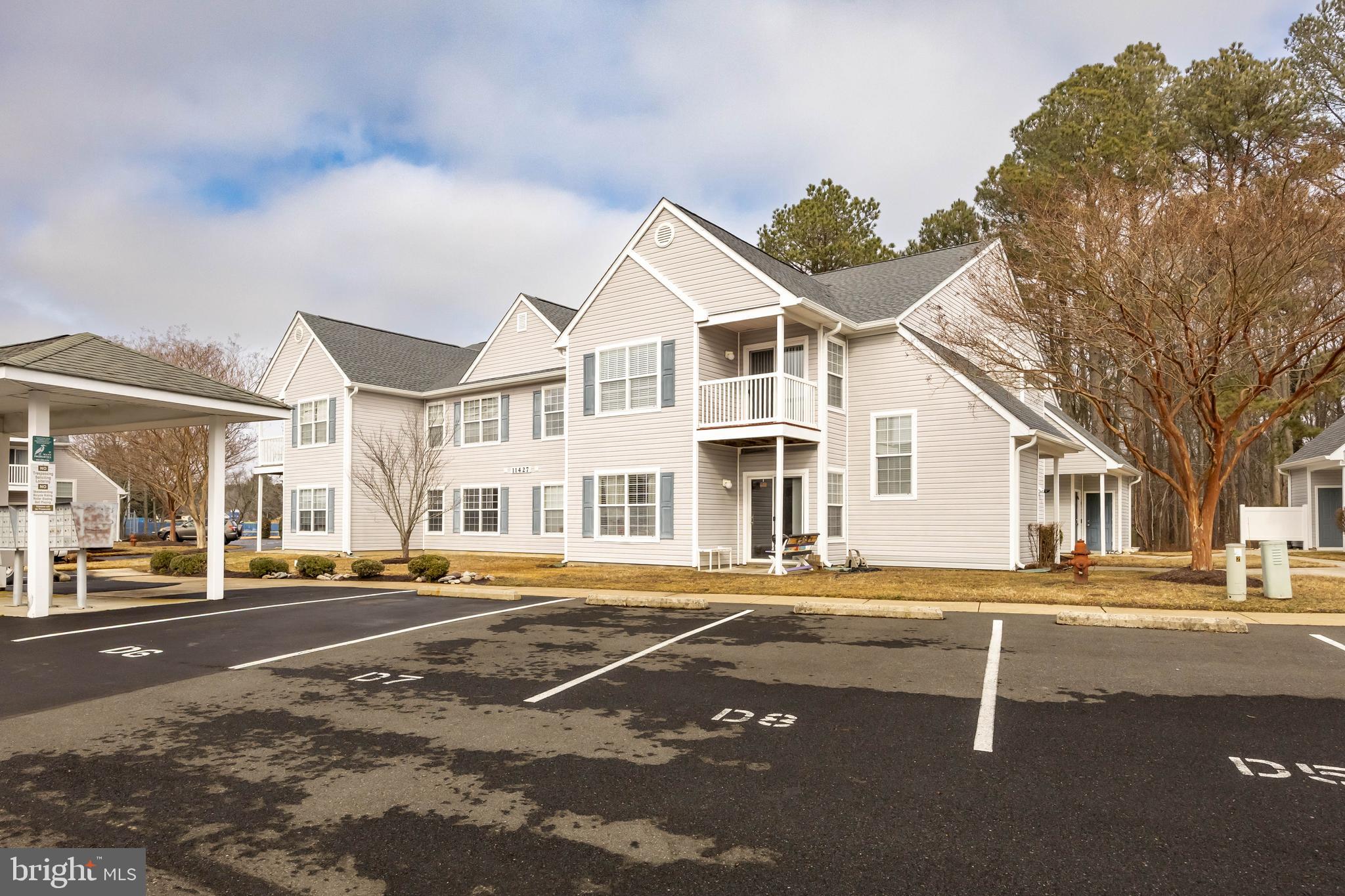 Spacious first-floor condo located in the desirable Meadows section of Ocean Pines. This 3-bedroom, 2-bath home features an open floor plan with a well-equipped kitchen offering a pantry, center island, breakfast bar, and dining area that flows into the great room. The primary suite includes a private bath and walk-in closet. The second bedroom is generously sized and located near the full hall bath. The third bedroom with French doors is perfect for a home office, den, or guest space. Enjoy a private patio just off the main living area. Includes one assigned parking space plus guest parking. Conveniently located near restaurants, shopping, dog park, tennis and racquetball courts, and community garden. Residents enjoy community amenities with the beaches and attractions of Ocean City just a short drive away.
