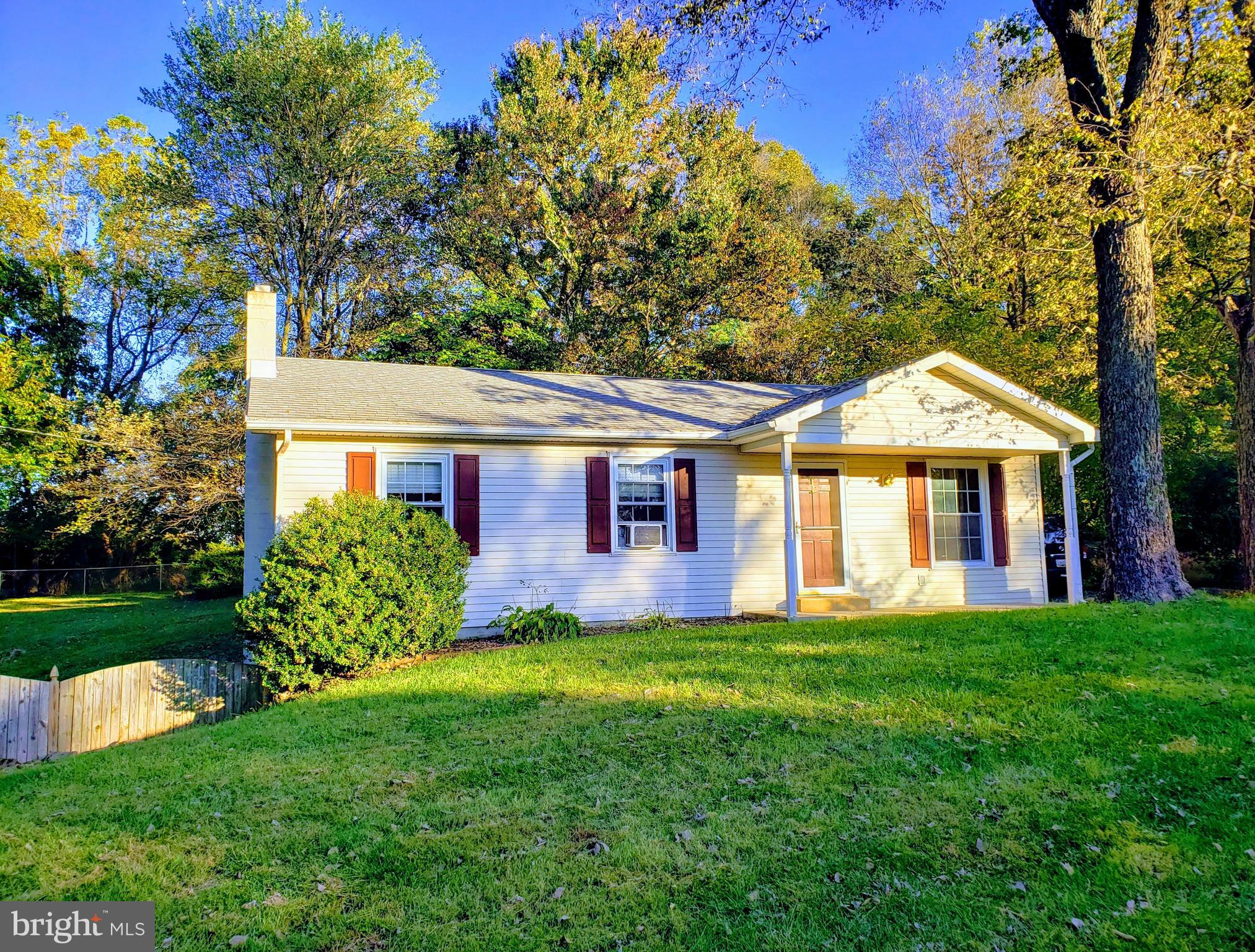 4 bedroom rancher with full finished walk-out basement in an established community in Shepherdstown.  Great ranch home, new roof in 2016, and freshly painted.  New carpet and professionally cleaned.  This is MOVE IN READY!  Hardwood thru main floor.  Finished walkout basement on partially fenced 1/2 acre lot.  Home is fenced in rear and backs to trees.  Enclosed screen porch off of kitchen extends living space.  Master suite with bathroom.  Full bath in basement.