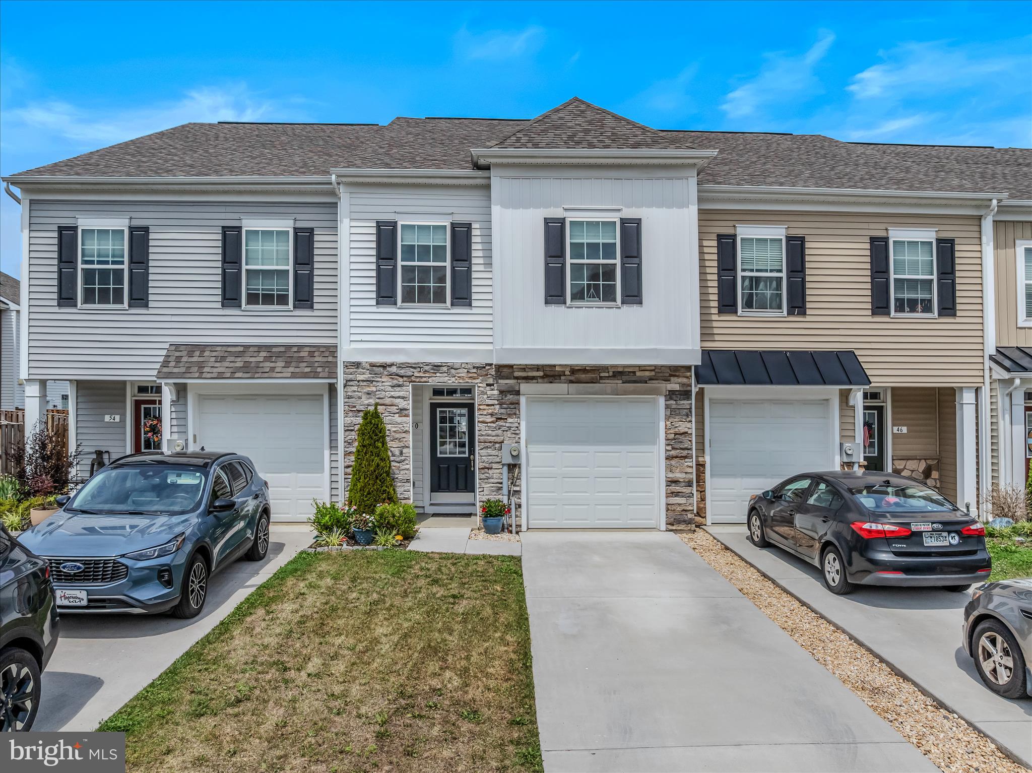 Welcome home to this immaculate, like-new townhome that perfectly blends style, comfort, and functionality. From the moment you step inside, you'll appreciate the tasteful finishes and abundance of natural light that fills the home.
The main level features beautiful LVP flooring, an open-concept layout, and a stunning kitchen complete with granite countertops, ample cabinetry, and modern finishes. Elegant hardwood stairs add a touch of sophistication and lead to the spacious upper level.
Retreat to the primary suite, where you'll find a large walk-in closet and a luxurious ensuite bath featuring a walk-in tile shower. The generously sized secondary bedrooms offer comfortable living space for family, guests, or a home office.
Step outside and enjoy the concrete patio, providing the perfect space for relaxing, grilling, or entertaining.
Meticulously maintained and move-in ready, this charming townhome offers the feel of new construction without the wait. Conveniently located near commuter routes, shopping, dining, and local amenities, this is one you won't want to miss!