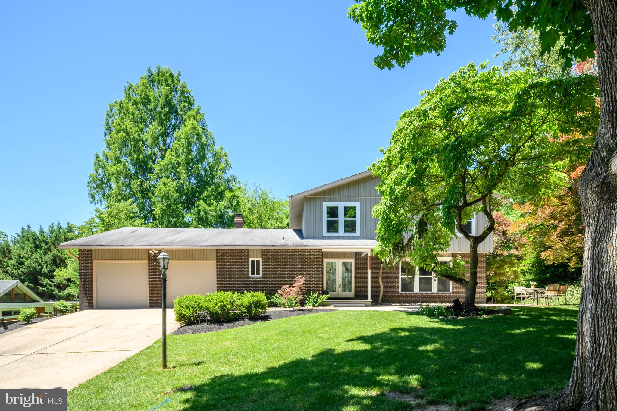 Welcome to The Birches, one of Columbia's best-kept secrets. As one of the original subdivisions within James Rouse's visionary planned community of Columbia, The Birches is nestled among towering trees and winding streets surrounding Wilde Lake. This beloved enclave offers a sense of character, community, and architectural distinction rarely found today. Here, no two homes are alike. Thoughtfully designed custom residences blend seamlessly into the natural landscape, creating a neighborhood that feels both private and connected. This beautifully renovated contemporary home offers over 3,000 square feet of living space across three finished levels, featuring 4 bedrooms and exceptional attention to detail throughout. The light-filled main level showcases an open floor plan with newer luxury vinyl wide-plank flooring for modern living and entertaining. The stunning eat-in kitchen features high-end cabinetry, quartz countertops, a large custom island with bar seating, a wine fridge, stainless steel appliances, a farmhouse sink with instant hot water, and an impressive wall of additional cabinetry and counter space extending into the dining area. The kitchen flows seamlessly into the spacious family room, creating the perfect gathering space for family and friends. Just off the kitchen, you'll find a cozy living room highlighted by a wood-burning fireplace and exposed wood ceiling beams. A renovated powder room (with heated flooring) and a convenient laundry/mudroom with garage access complete the main level. Upstairs, the spacious primary suite features a beautifully renovated bath with dual shower heads. Three additional generously sized bedrooms share a renovated hall bath with dual vanities. Outside, enjoy a private, professionally landscaped setting overlooking Wilde Lake. Outdoor improvements include a Trex deck, covered patio, and extended hardscape patio, providing multiple spaces for relaxing and entertaining. An expansive front patio further enhances the home's outdoor living areas. Completing the property is an oversized two-car garage. Enjoy morning walks around the lake, peaceful wooded views, and the convenience of being minutes from downtown Columbia, Merriweather Post Pavilion, restaurants, shops, and major commuter routes (Rt. 29, Rt. 100, Rt. 32, and I-95). The yearly HOA Fee (CPRA- Columbia Association) offers many amenities, including nearby walking paths, playgrounds, open green spaces, and discounted memberships to gyms, pools, and golf courses. Recent updates include fresh paint ('26), refrigerator ('25), washer/dryer ('25), HVAC ('23), Water Heater ('23), Dining Room built-ins ('22), Kitchen Island ('22), Wood Flooring ('21). Rarely does an opportunity arise to own a thoughtfully updated home in one of Columbia's most desirable and architecturally distinctive neighborhoods.