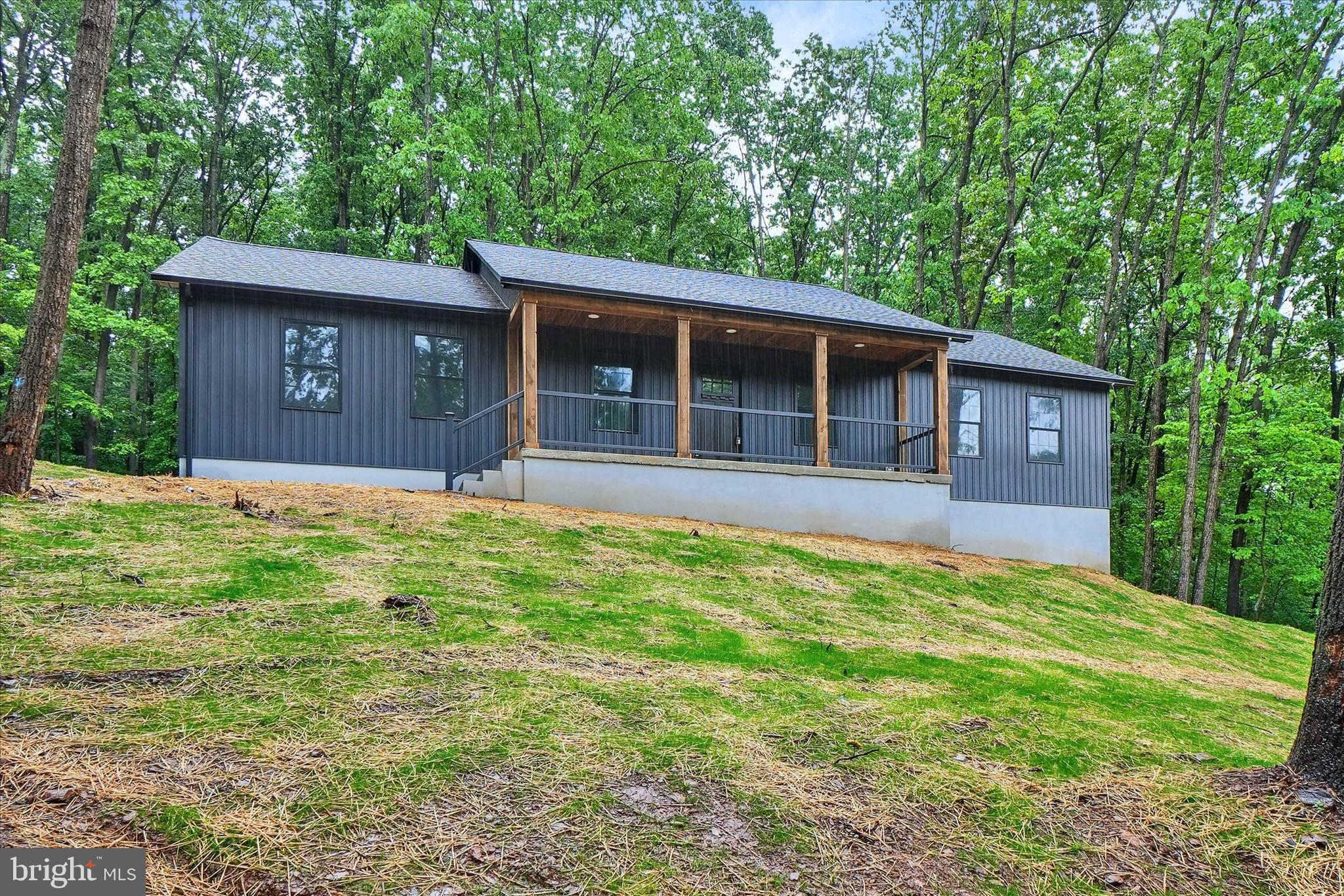 Brand new stunning ranch style home offers the perfect blend of modern design, quality craftsmanship, and peaceful wooded surroundings on a beautiful 1 acre lot in Southern York County School District.

This spacious home features 1,920 finished square feet above grade with an additional 1,920 square feet of unfinished lower level space ready for future expansion, storage, workshop space, or recreation areas.

Step inside to an open and inviting floor plan with luxury vinyl plank flooring throughout the main living areas and a dramatic vaulted ceiling in the family room that creates a bright and airy feel. The kitchen opens seamlessly to the dining area and family room, making it ideal for both everyday living and entertaining.  Refrigerator is on order and will be installed before settlement.

The thoughtfully designed layout includes 3 bedrooms and 2 full baths, including a spacious primary suite with a private bath, walk in closet, and direct access to attic storage. All bedrooms feature walk in closets, offering exceptional storage space throughout the home.  Mirrors for bathrooms are on order and will be installed before settlement.

Enjoy the peaceful setting from the covered front porch overlooking the wooded surroundings while still being conveniently located near Maryland line commuting routes, local amenities, and everything Southern York County has to offer.

A rare opportunity to own a newly built ranch home with room to grow in a beautiful country setting.