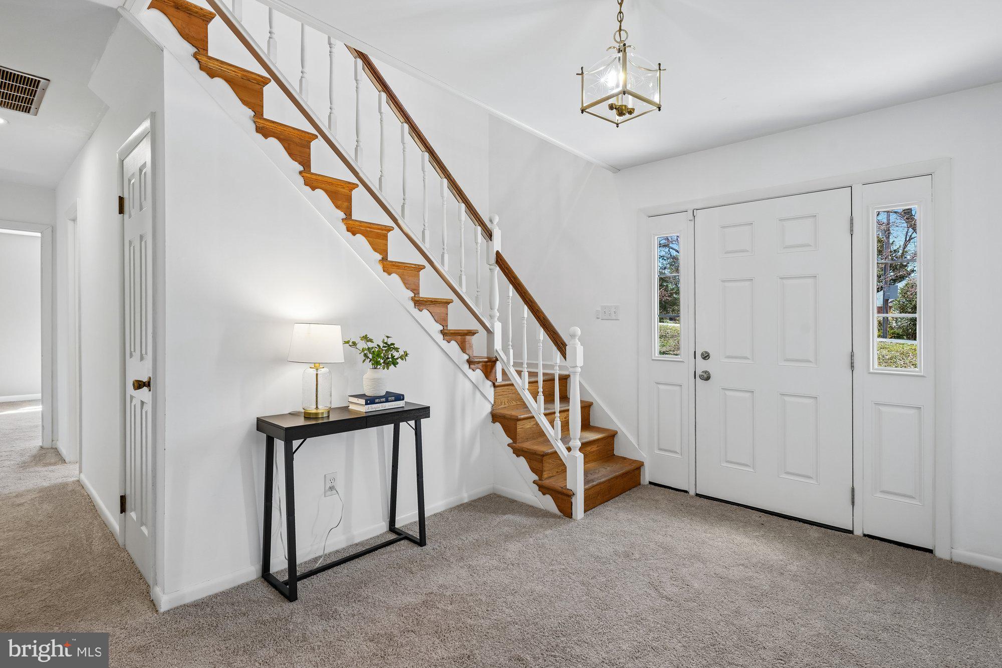 Take advantage of a rare opportunity to assume a 3.37% VA loan and enjoy significantly lower monthly payments in today’s market. Nestled on a private, wooded one-acre corner lot in La Plata, this property offers the space, flexibility, and freedom that today’s buyers are actively searching for—without HOA restrictions. Perfectly positioned for military and government commuters, the home is within 30 miles of PAX River Naval Air Station, Indian Head, NSF Dahlgren, Joint Base Andrews, and Washington, DC, making it an ideal choice for relocation or long-term convenience.

This home blends peaceful surroundings with everyday practicality, featuring a large, fenced backyard, patio access, and plenty of room to create your own outdoor retreat with space for entertaining, gardening, or future additions like a pool or firepit. The extended driveway accommodates seven or more vehicles with ease, and the oversized two-car garage currently functions as a workshop, offering incredible versatility for contractors, hobbyists, small business owners, or anyone needing dedicated workspace for tools, projects, or storage.

Inside, the flexible layout is designed for modern living, with two main-level bedrooms that can serve as guest rooms, a home office, gym, or multigenerational living space. The mudroom and laundry area provide convenient access to the backyard, adding to the home’s functionality. Upstairs, you’ll find a bright and spacious living area with hardwood floors, a dining space, a sun-filled den with windows on three sides, a kitchen with new appliances, and three additional bedrooms including the primary.

Located just minutes from shopping, schools, dining, Charles County Government offices, and the regional hospital, this home offers the perfect balance of privacy and accessibility. With room to grow, space for your lifestyle, and the added value of an assumable low-rate VA loan, this property presents a unique opportunity to customize, build equity, and enjoy everything La Plata has to offer.