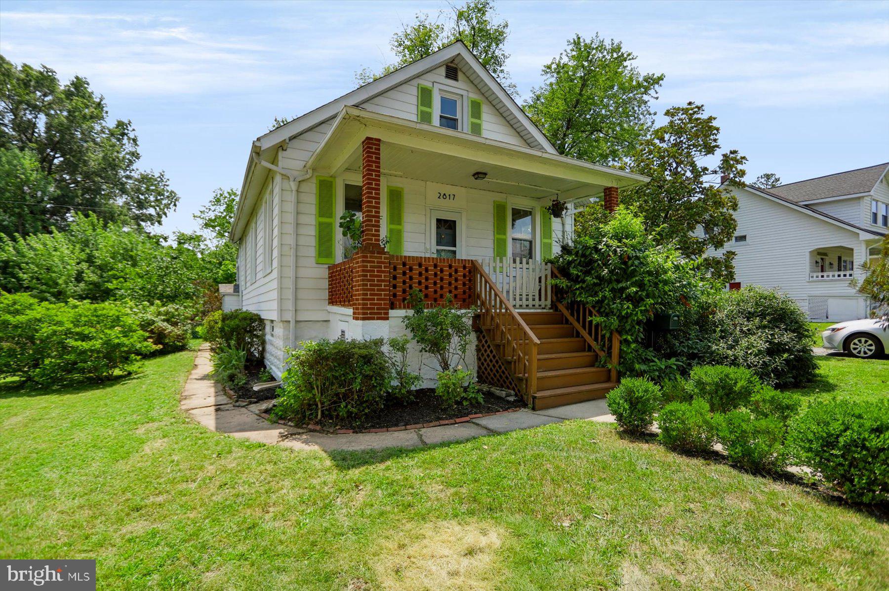 Your urban oasis awaits! Just minutes from the Hamilton- Lauraville main street, this charming bungalow sits on an expansive DOUBLE lot lovingly cultivated with mature trees. Just shy of 1/5th of an acre, this exterior space features two off street parking spaces, a fenced in back yard with an enclosed flower bed, and an isolated area that previously housed chickens and goats! Canopied by magnolia, oak, and cypress trees, the four bedroom home sits off of the street allowing privacy on both the front porch and back patio. As you enter, you're greeted with artistic charm from the built-in shelving and arched thresholds to the hardwood flooring. The main level features two bedrooms and a full bathroom, perfect for single level living. The second floor has been finished, expanding the original 969 square feet by two additional bedrooms. The basement allows for future expansion. Recent updates include HVAC (2022), HWH (2023), roof (2021), window repairs in progress (2026), sump pump/french drain, and updated appliances and fencing (2021). Complete list of mature plants include: black gum, black oak, oak, magnolia, swamp magnolia, bald cypress, red bud, purple red bud, Japanese maple, ornamental plum, fruit bearing plum, dwarf apple, rose bushes, climbing roses, hydrangeas, azalea, boxwoods, arborvitae, and ornamental grasses.