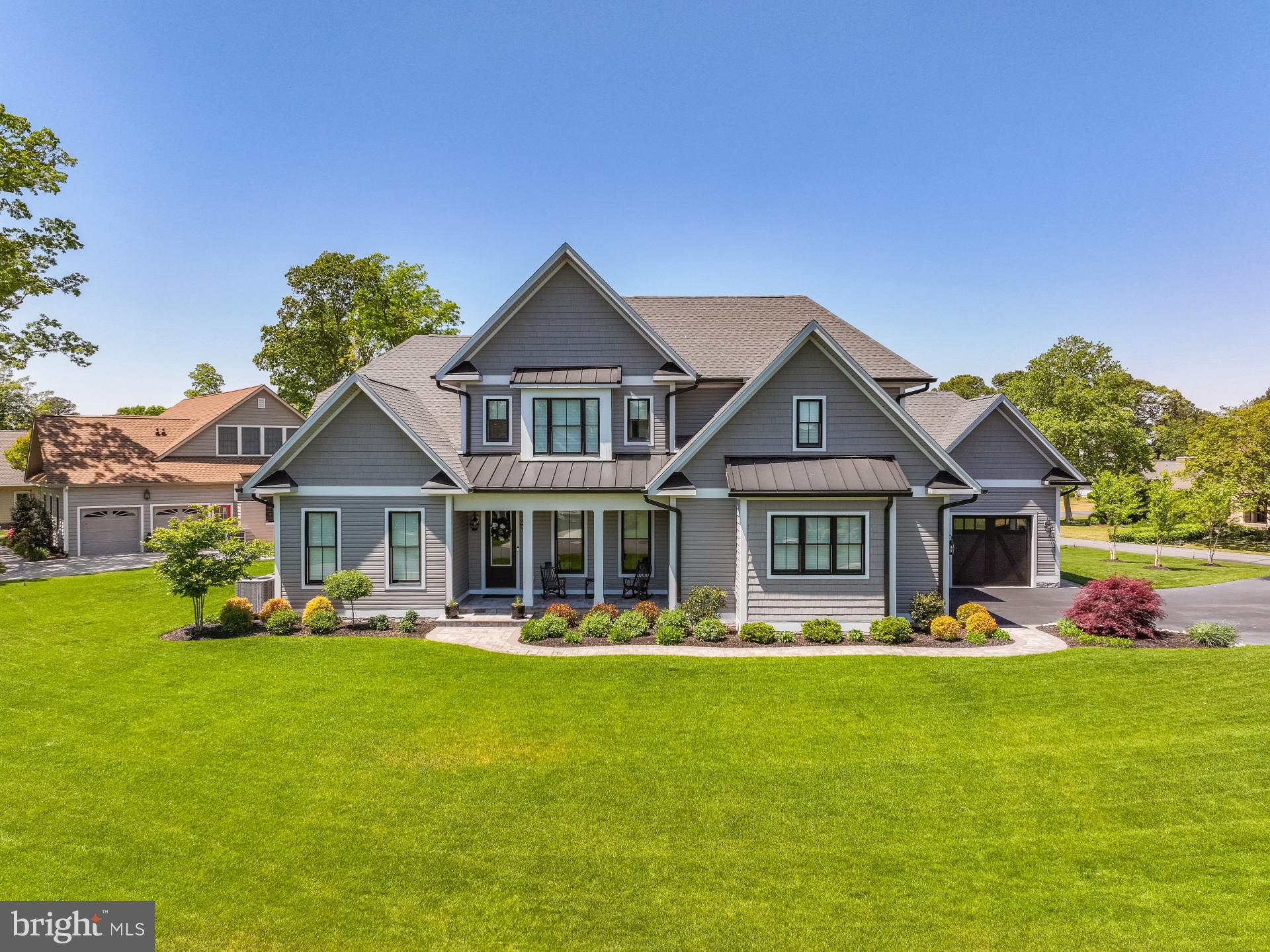 Welcome to this like-new custom built home that is a beauty! The premium upgrades in
this home are details that cannot be overlooked. Situated on a generous lot size of 0.52
acres, this property provides a private and serene setting for its residents. Whether you
enjoy spending time outdoors or simply appreciate the peace and quiet of a secluded
location, this home offers the perfect balance of privacy and convenience. Bay Colony is
a waterfront community, which has its own private beach with several boardwalks,
tennis/pickleball courts, outdoor swimming pool, clubhouse, and gated boat marina. It’s
a short distance to your feet in the sand at Bethany Beach and downtown
restaurants/shops. Golf enthusiasts can enjoy the nearby (less than a half mile) Cripple
Creek golf course. With a total finished area of 3,300 square feet, this two-story home
offers plenty of room for families or individuals looking for a spacious and well-designed
living space. The open floor plan allows for a seamless flow throughout the main level,
making it ideal for entertaining guests or simply relaxing at home. On the main level of
this home, you will be greeted with a grand foyer that opens into an office/flex room
through custom barn doors; continuing to the great room, there are 11' coffered ceilings
and a gas fireplace. A spacious chef's kitchen/dining that is well-appointed and a joy to
cook in, enjoy your meals, and entertain family and friends; this area will be the hub of
the home. A cozy keeping room with an additional gas fireplace and a 17' vaulted ceiling
awaits you. The master bedroom/en-suite has an oversized shower and standalone
soaking tub, and custom closets will allow for a well-organized wardrobe. From the side
entry, the mud room is a great place to store your shoes, coats, and accessories. The
laundry room is adjacent to the mud room and a butler's pantry. Throughout the main
living, you can enjoy your favorite music with the surround sound of Sonos speakers, as
well as in the screened-in porch area. As you proceed to the upper level, a spacious
second master bedroom/en-suite is privately located at the rear of the home. Two
additional bedrooms, playroom or second office, and jack and jill bathroom are also on
the second level of the home. The exterior of the home features a stylish and modern
design, with a well-manicured lawn and premium landscaping that adds to the overall
curb appeal. A well for outside watering of the irrigated lawn will ensure you can water
as often as you want without worrying about increased water charges. An oversized two
car garage and single garage will be a great place to keep your vehicles from the
elements of the weather. The concrete flooring has been coated with commercial grade
material. Relax and enjoy the outdoors in the screened in porch with a vaulted ceiling.
As you exit the porch, you enter a paver patio which is great for relaxing around a firepit
or lounge chairs to enjoy those sunny summer days. There are ample storage areas
within the home and garage areas. Overall, this home is a beautiful and well-appointed
property that offers the perfect blend of modern amenities and comfortable living
spaces. With its prime location surrounding the beaches of DE, this home is sure to
provide its residents with a wonderful place to call home for years to come. Don't miss
your chance to make this property your own and enjoy all that it has to offer. Community

HOA is $100/monthly; however, the marina is a separate entity and would require
additional fees to be a member.