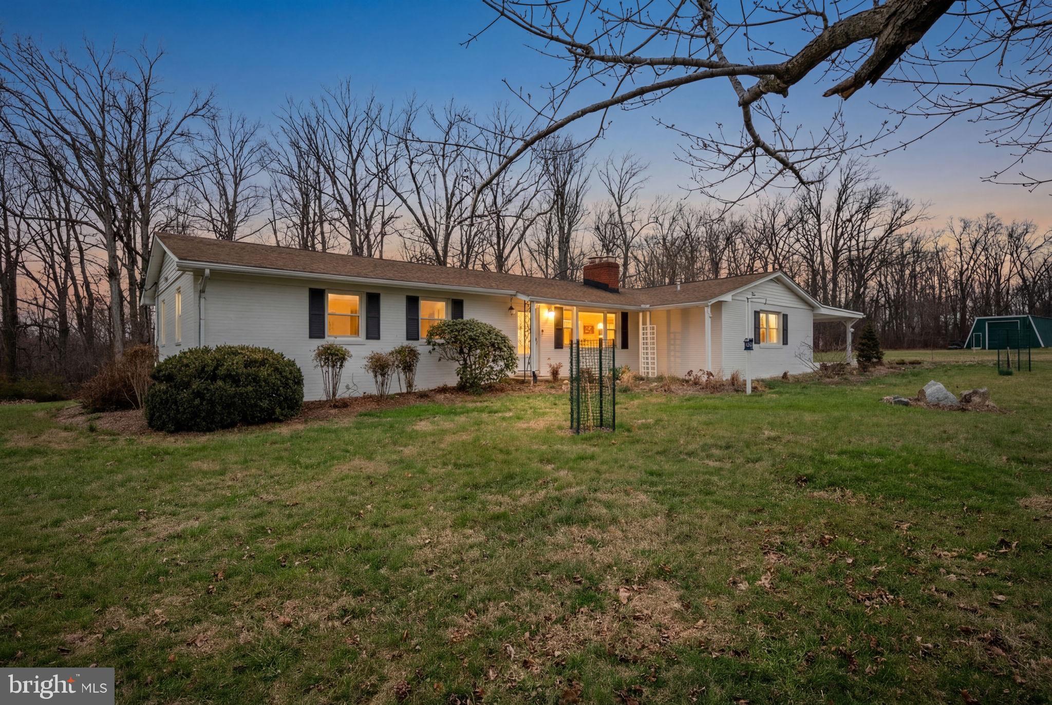**PRICE DECREASE!** Incredible value for this home's size, lot, and features in Howard Co.

RENOVATED & LIKE-NEW 5-bedroom, 3-full-bath ranch set on a peaceful 3-acre homesite in sought-after Howard County, served by Howard County Public School System. This move-in-ready home features a brand-new kitchen with granite countertops and stainless steel appliances, three fully renovated bathrooms, refinished hardwood floors, and two fireplaces. Major updates include a new roof, boiler, water heater, and washer & dryer. The unfinished lower level offers excellent expansion potential with a fourth full bath already roughed in. Enjoy privacy and space with approximately 1,000 feet of road frontage and a massive detached 6+ car garage, perfect for car enthusiasts, storage, or a workshop. Quiet setting, modern upgrades, and exceptional land—this property offers a rare combination of comfort, privacy, and opportunity.

Full video of property and house available, contact listing agent for link.