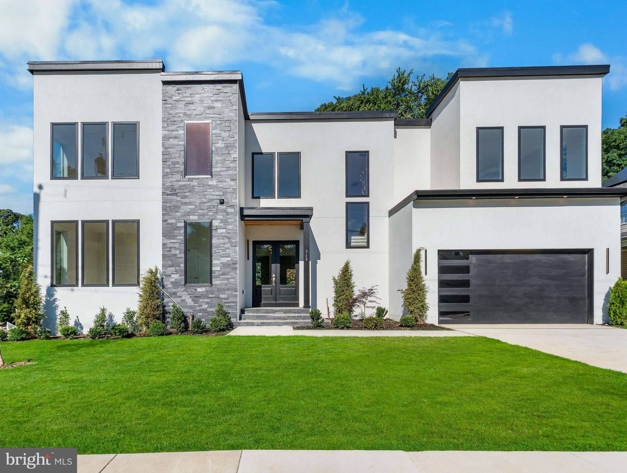 Move-In Ready Luxury in the Heart of Vienna

Welcome to 719 Meadow Lane SW, a stunning new custom home offering over 5,830 square feet of thoughtfully designed luxury living in one of Vienna’s most desirable locations. With 6 bedrooms, 6.5 baths, a main-level guest suite, private office, loft, finished lower level, wet bar, and fitness room, this exceptional residence seamlessly blends modern elegance with everyday comfort.

At the heart of the home is a spectacular chef’s kitchen designed to impress, featuring a premium Thermador appliance package including a 48-inch built-in refrigerator, 48-inch professional gas range, two dishwashers, and two convenient drawer microwaves. Additional highlights include a wine and beverage cooler, built-in ice maker, custom cabinetry, walk-in pantry, and an impressive waterfall island that anchors the space—perfect for effortless entertaining and daily living alike.

Expansive Andersen casement windows flood the home with natural light, showcasing the open-concept floor plan, soaring ceilings, and designer finishes throughout. The luxurious owner’s suite serves as a true private retreat, complete with dual walk-in closets and a breathtaking spa-inspired marble bath with premium finishes and timeless sophistication.

The fully finished lower level offers exceptional flexibility, featuring a spacious recreation room, stylish wet bar, dedicated gym, guest bedroom, and full bath—ideal for entertaining, accommodating extended family, or creating a private retreat.

Situated on a desirable corner lot with no HOA, this move-in-ready home offers the rare combination of luxury, location, and convenience. Enjoy being just minutes from Vienna Metro, Tysons Corner, downtown Vienna, parks, shopping, dining, and major commuter routes, making everyday living as convenient as it is elegant.

Luxury finishes. Exceptional craftsmanship. Unbeatable Vienna location.
Don’t miss this rare opportunity to own a remarkable new construction home in the heart of Vienna. Schedule your private tour today.