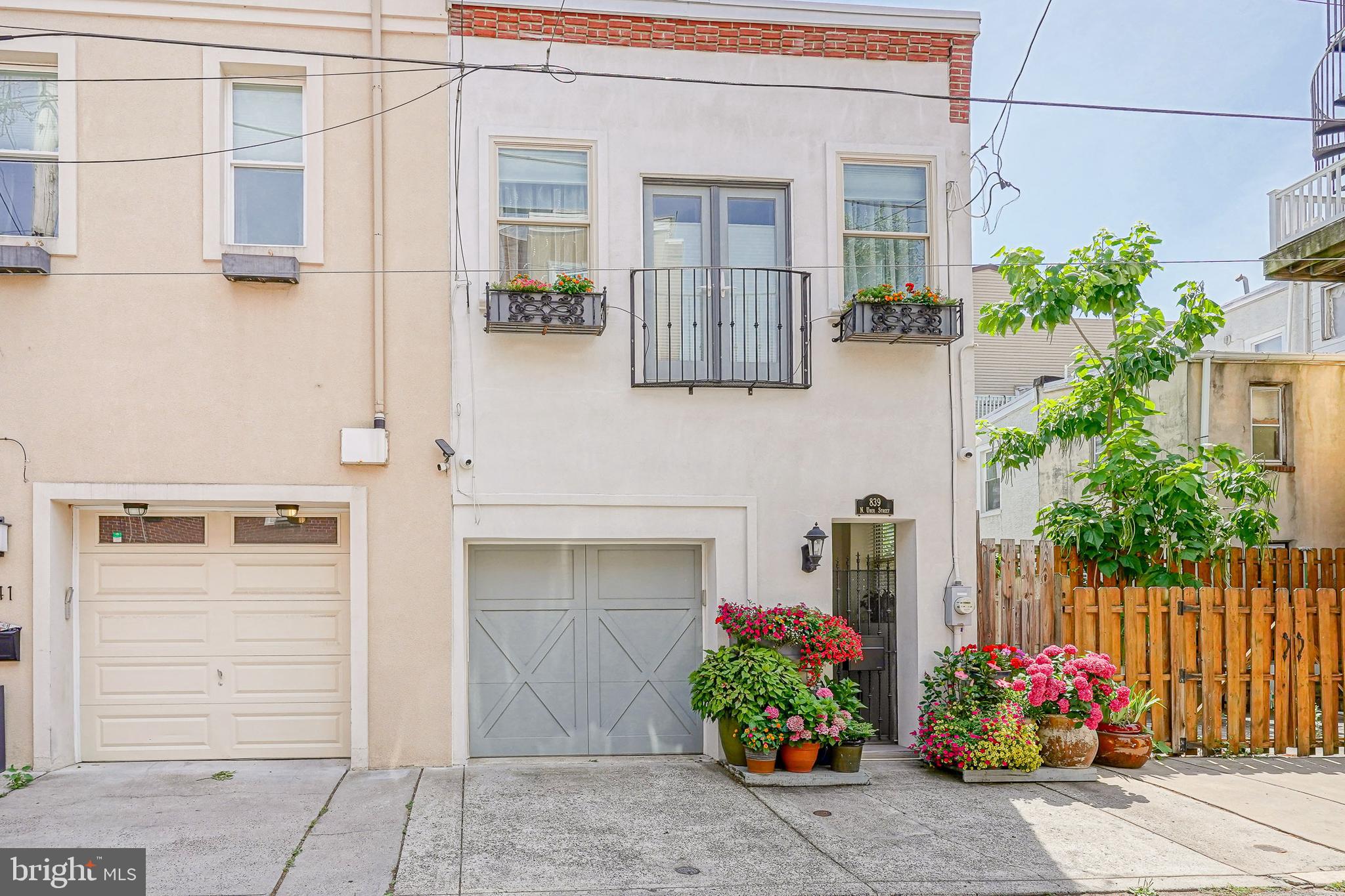 Introducing this magnificent one of a kind custom built carriage home located on a beautiful tree lined street in Philadelphia. Located steps away from Fairmount Avenue and the Art Museum area, this 3-bedroom, 2.5 bathroom + bonus room end home has everything you need for city living right at your fingertips. As you approach the home you are greeted with a charming Juliet balcony, flower boxes, gated breezeway and 1 car garage. Entering inside through the breezeway you immediately notice the 1st floor's 10-foot-high ceilings, south facing windows and spacious main living space with 5-foot Porcelain Porcelanosa tiles and board and batten wall. This floor features your main living space, half bathroom, the living room, dining room, kitchen, and bonus room equipped with a side-by-side washer/dryer with ample storage. The sleek modern kitchen recently updated in 2022 features a Sub Zero 42-inch side by side refrigerator with ice maker, Miele appliances including (Combi/Steam oven, 30“ oven, induction cooktop, and dishwasher), Best downdraft, Porcelain countertops, a large sink with built in drainboard and high end Porcelanosa cabinets. The 2nd floor has all 3 spacious bedrooms and 2 full bathrooms conveniently located on the same floor which is extremely rare for city living. The primary suite includes an on-suite bathroom, large walk-in closet with built-ins, French doors, a Juliet balcony and ample south facing sunlight with automatic blinds. The 2nd and 3rd bedroom and full bathroom all feature ample closet space and south facing sunlight. The 3rd bedroom is currently being used as a sewing room. The 3rd floor pilot room is an entertainer's dream with both its indoor and outdoor entertainment space. This 3rd floor also includes a mini kitchen with bar sink, dishwasher and beverage fridge. 2 sliding glass doors open to the outside floating deck recently done in 2023. This space features a retractable awning with a wind sensor. New roofs installed in 2021 and 2022. Mini split installed in 2024 to 3rd floor. House has 2 zones. The 1 car garage includes additional storage and second entry to the home. With the homes desirable features and location to the best cafes, restaurants, grocery stores, parks and entertainment this home will not last long.