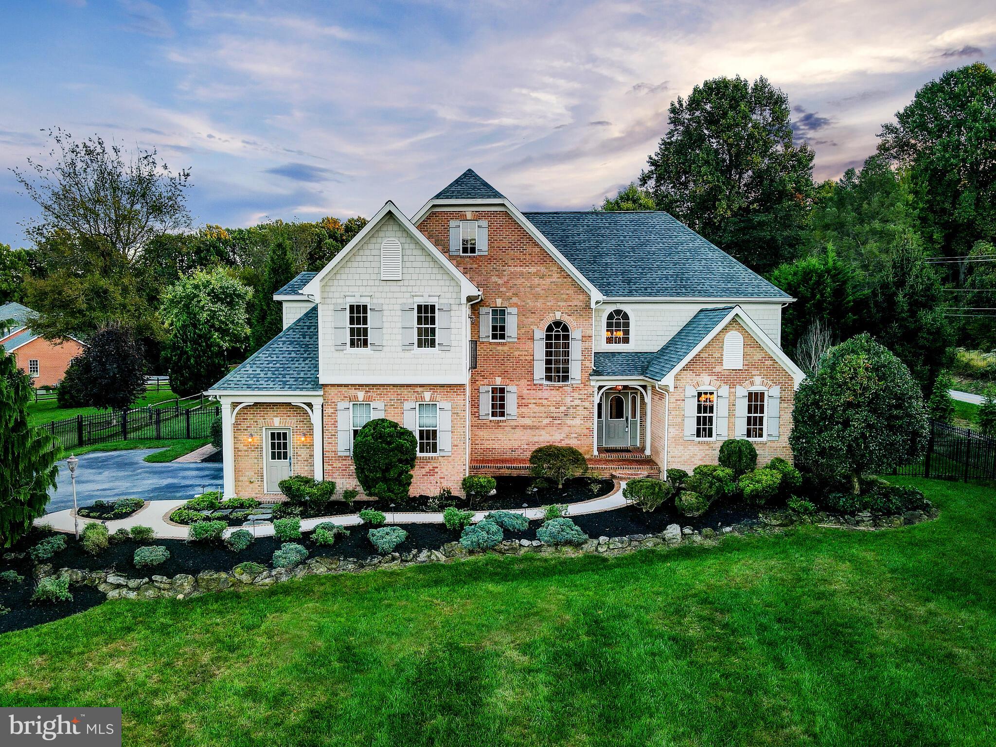 Stunning custom home in Beautiful Lutherville/Timonium. Open floor plan with luxurious designer features throughout.  Relax in the two story great room in front of your gas fireplace with french doors to the outdoor patio. Gourmet kitchen with two tone cabinets and granite counter tops, high end stainless steel appliances, range hood with custom cabinetry and walk in pantry. Eat at the oversize kitchen peninsula overlooking the great room living area, equipped with a built in wine fridge, or at the dining morning room in front of the light filled bay window looking out over the patio. Main level owner's suite with cathedral ceiling, gas fireplace, corner spa bath, heated floors, walk in closet. Spacious finished basement lower level with 9ft ceilings, office, full oversized bedroom suite, with full bathroom and living area with wet bar. Two car side garage, and flat landscaped backyard. Truly peaceful, convenient location. This one is ready for you!