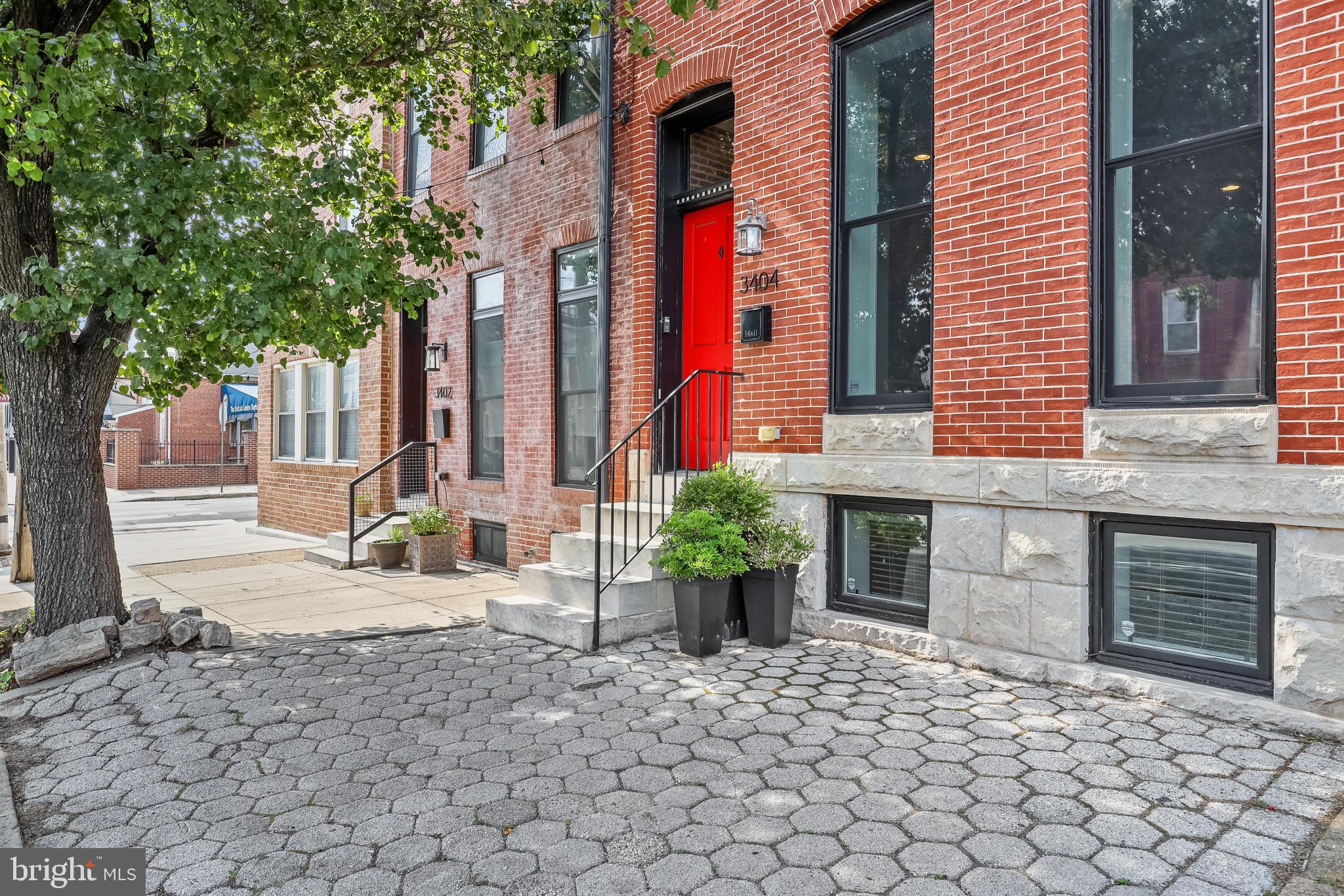 ONE OF A KIND CHAP TAX CREDIT RENOVATION IN PREMIERE CANTON LOCATION - this extraordinary 16' wide home is a seamless blend of historical preservation and modern amenities with a massive rear addition that offers nearly 3000 sq ft of living space with soaring 10' ceilings, hardwood floors throughout, crown molding & coffered ceilings, exposed brick and designer island kitchen with breakfast bar, commercial grade ss appliances, custom cabinetry, quartz counter tops, under cabinet lighting and tile backsplash with convenient half bath leading to large rear dining room, fenced in private patio & two car parking pad.  The expansive upper level includes 3 bedrooms, 2 bathrooms, laundry room and wet bar with hallway access to roof top deck.  Fully finished basement with two additional bedrooms - this one is a must see! 4 years remaining on the chap tax credit with almost a $9000/yr savings  - current taxes only $4568!!!