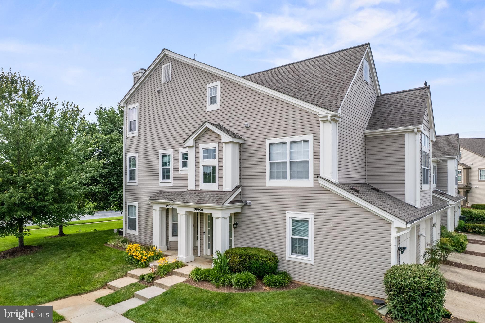 Some mornings, you just don't want to leave.
That's what Scenery Pointe does to you. Cherry blossoms lining the circle in spring. Tree-lined views from your private patio. A quiet, beautifully maintained community that feels like a retreat — even though you're minutes from everything.

The main level features a wood-burning fireplace, luxury hardwood flooring, a separate dining area, and an updated kitchen with upgraded countertops and stainless steel appliances. Slide open the glass doors and you're on your private patio — morning coffee territory.

Upstairs, the primary suite has a soaring ceiling, walk-in closet, and a beautifully appointed bath with a jetted tub and double vanity with Carrara quartz top.

Have an electric car? The attached one-car garage is ready for you — add your own charger and you're set. Plenty of guest parking throughout the community means visitors are always welcome too.

The HOA covers exterior maintenance, lawn care, snow removal, and trash. Weekends stay yours.

Right off I-270 and Route 355. Less than 10 minutes to AstraZeneca Gaithersburg. Minutes to Holy Cross Germantown Hospital and Milestone Shopping Center.

Peaceful. Practical. And exactly the kind of place you'll be glad you found.