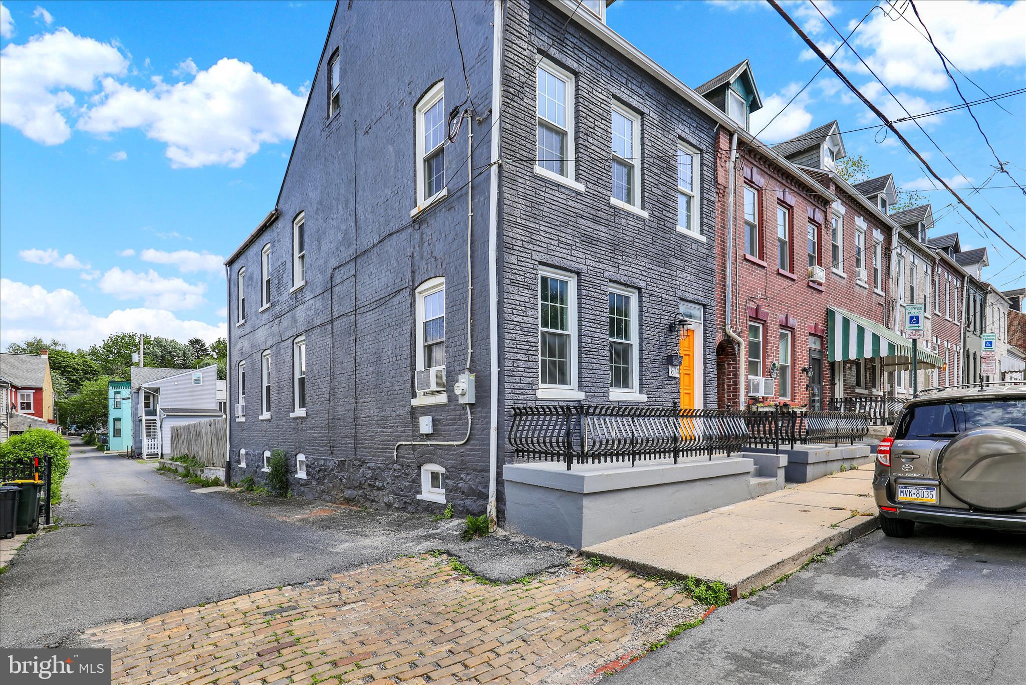 Attractive investment opportunity with significant upside — or instant equity for an owner-occupant ready to put their stamp on it. This end-unit row home in Cabbage Hill offers a flexible path whether you're building a rental portfolio, targeting a renovation-to-resale, or looking to own in one of Lancaster City's most established neighborhoods.

As an end unit, you get three-sided natural light that most row homes in this neighborhood simply can't offer. The 3-story layout delivers 4 bedrooms, 1.5 baths, and approximately 1,600 square feet of space that works well as a premium rental or a renovation project targeting Lancaster's active buyer pool.

Approximately five years ago the property underwent extensive renovations. An exposed brick wall leading to the fourth bedroom and attic adds character and charm that resonates with today's buyers. With solid updates already in place and plenty of room to add your own finishing touches, the upside here is real.
Out back, the yard has alley access and the footprint for a potential parking conversion. Zoning has been preliminarily discussed and township approval would be the required next step — in urban Lancaster, dedicated parking is a meaningful value-add for both rental income and resale positioning.

Seller is a licensed real estate agent in the Commonwealth of Pennsylvania. Sold as-is.