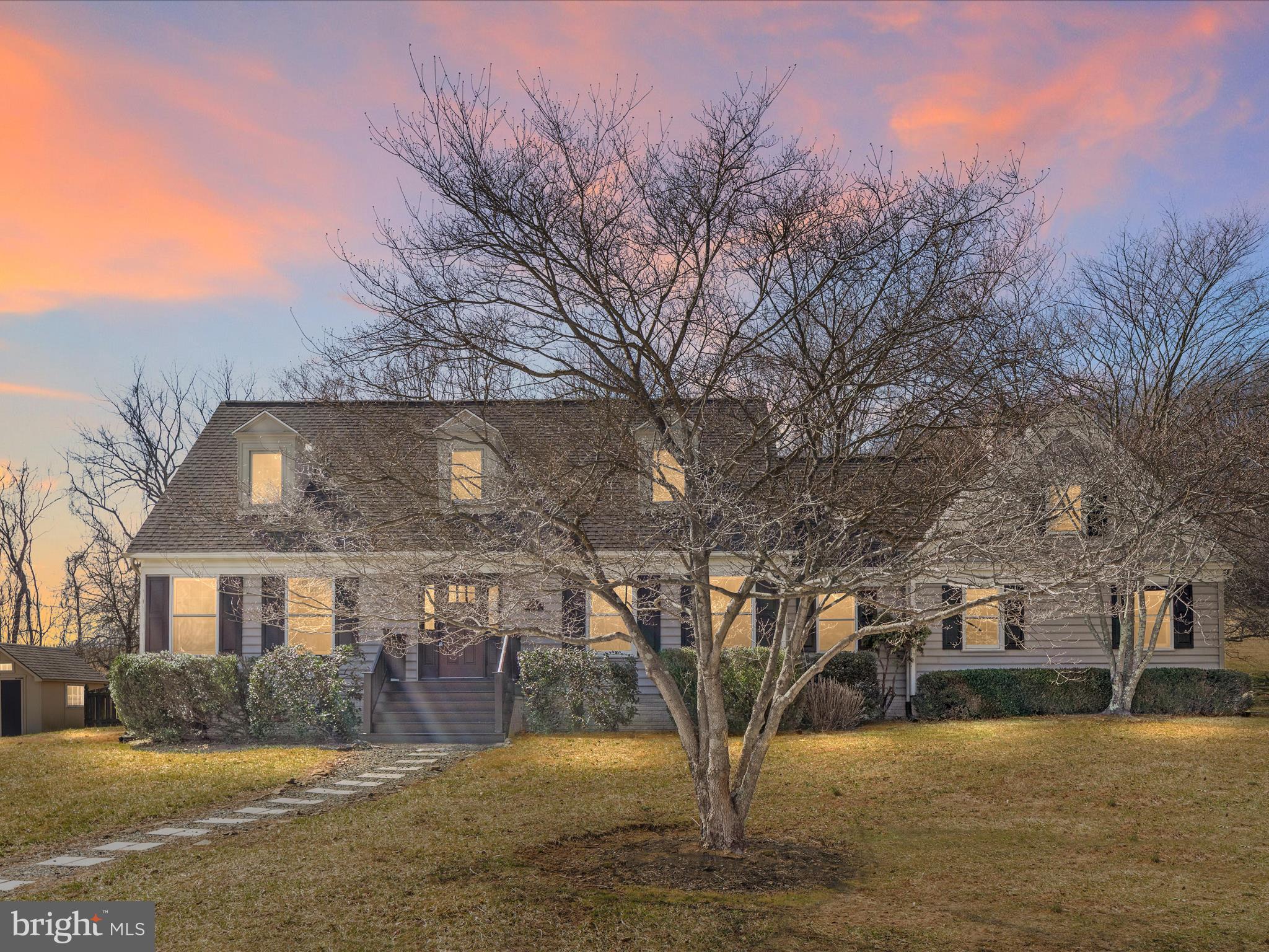 Think Virginia Hunt Country meets Colonial New England. Think quaint Cape Cod  architecture meets historic Williamsburg. Step back in time to a property like no other, designed and built by the current owners. You won’t want to leave. <br><br>
Think best lot in the neighborhood. Private. Backing to common area and vineyards. 1.5 acres of serenity.  Stone walls. Framed by woods yet dotted with open fields. You will feel like you are away from it all. <br><br>
Custom interior trim, crown moldings, palladian windows, Hard woods, colonial colors.  A one-of-a kind floorplan with main level primary suite and 2 bedrooms upstairs.  Unfinished lower level with a million possibilities. <br><br>
Newer roof, brand new upstairs carpet and paint. Rear patio surrounded by lush plantings and a picket fenced rear area to contain the kids or pets. <br><br>
A perfect Western Loudoun location in a community with ponds, gravel roads, and a towne green.  It’s truly special. And even lovelier in person.  <br><br>
I wouldn’t wait if I were you.