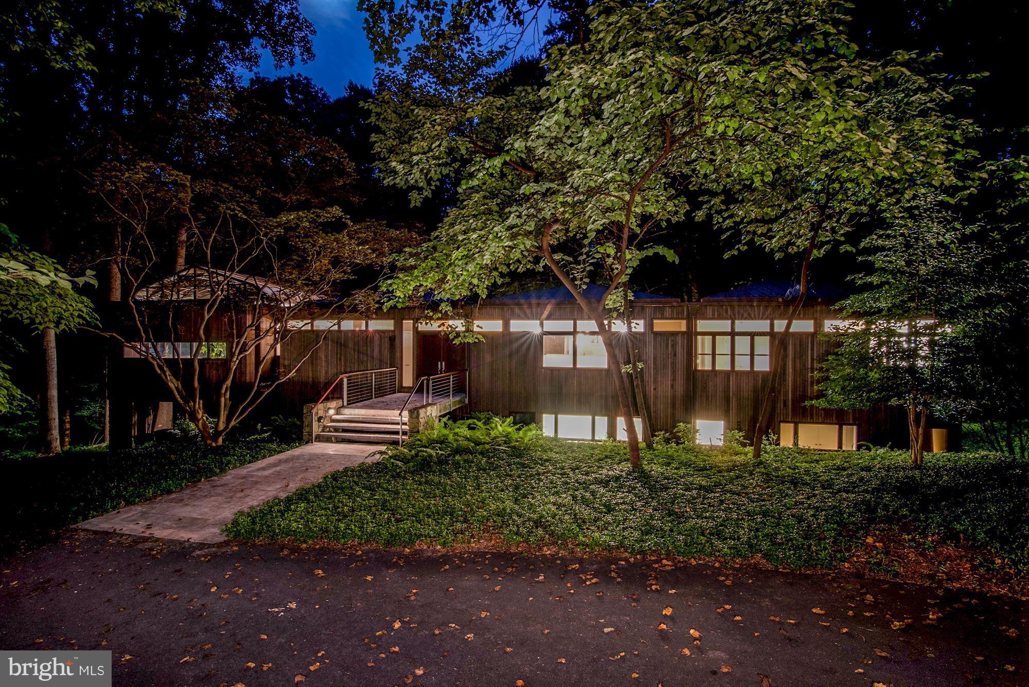 Stunning contemporary on 1.3 acres with easy access to DC and Potomac Village, 270/495.  Extraordinary design of steel, wood and glass.  Main level MBR suite, fully finished walk-out LL, gorgeous wooded views, heated pool, sauna, exercise room, Koi pond and more.  An exceptional house that one rarely finds.
