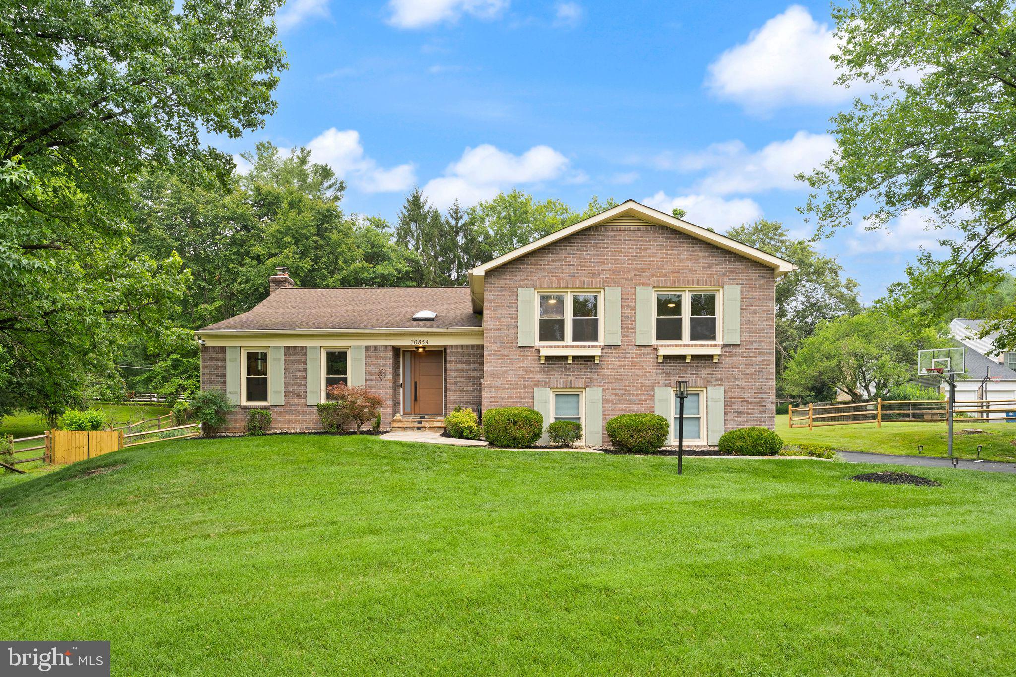 Located on a quiet cul-de-sac in the highly desirable Berryland Farm community of Oakton, this exceptional four-bedroom, three-bathroom home perfectly blends tranquility and character.

As you step through the brand-new front door (2025), you are greeted by a generous tiled foyer with two hall closets and a remarkably spacious, light-filled living room. The intuitive, open floor plan boasts high ceilings and an organic separation of spaces that keeps the home feeling connected yet distinct...ideal for both everyday living and upscale entertaining. The updated kitchen is a chef's dream, complete with custom cabinetry, rich black walnut countertops, updated appliances, and exquisite hand-painted tiles imported from Portugal. Enjoy your morning coffee in the bright breakfast room, where a beautiful bay window overlooks the backyard oasis.

The main level also features an expansive family room defined by soaring cathedral ceilings and a beautifully restored structural beam sourced from a historic 1938 Washington, D.C. schoolhouse. Fresh paint and brand-new luxury vinyl plank (LVP) flooring (2025) flow throughout the entire home, tying the spaces together with a clean, contemporary finish. The primary suite serves as a peaceful retreat, offering multiple spacious closets and a sun-drenched bathroom complete with a separate shower stall and a modern floating bathtub.

The fully finished lower level offers incredible versatility, featuring a large recreation room, an updated laundry room, and a private bedroom with a full bathroom—perfectly suited for a secluded home office or a comfortable guest suite.

Step outside through the walk-out lower level to discover a premium outdoor paradise. The flat, fully fenced backyard features a refurbished deck for open-air relaxation, a brand-new storage shed (2026), and a sumptuous swimming pool equipped with a brand-new pool pump (2026), making it completely turn-key for warm summer days.

Living in Berryland Farm means enjoying a vibrant, tight-knit community. Residents have access to beautifully maintained common grounds, walking trails, tennis and pickleball courts, and two tot lots. The active HOA hosts fantastic year-round events, including an annual picnic, Easter and Halloween parades, holiday parties, and neighborhood food truck visits. This home offers the ultimate combination of privacy, charm, and neighborhood amenities.