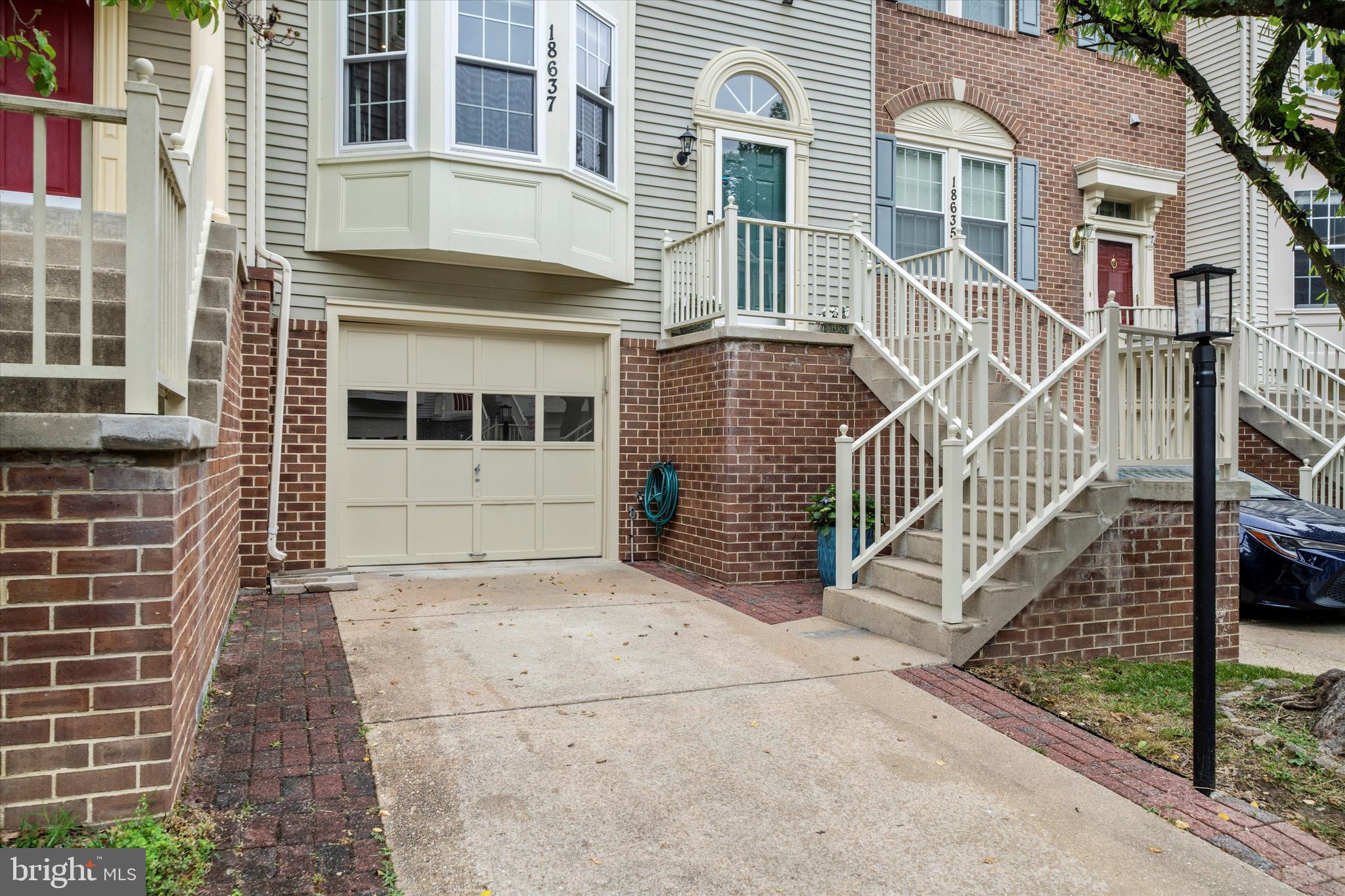 Welcome to this beautifully appointed and updated garage townhome in the highly sought-after James Creek community! This exceptional home features an open and airy floor plan with bump-out bay windows on both the main and upper levels, filling the home with abundant natural light. The main level showcases gleaming hardwood floors and an updated gourmet kitchen complete with granite countertops, stainless steel appliances, ample cabinetry, new under-cabinet lighting, and updated downlighting that enhances both the kitchen and lower level spaces.

The spacious primary suite offers a vaulted ceiling and a stunning newly renovated spa-inspired primary bathroom completed in 2025. Additional updates include brand-new windows throughout the home in 2025 and a new roof installed in 2024, providing peace of mind for years to come.

The finished lower level features a spacious recreation room with a cozy wood-burning fireplace and a rough-in for a future bathroom, offering excellent flexibility for additional living or entertaining space. The laundry and finished one car garage on this level complete this space.
Enjoy outdoor living with a large deck off the main level, perfect for gatherings and summer evenings, along with a fully fenced backyard featuring a patio area and lawn space for relaxing, gardening, or play.

Ideally situated within the community, this home offers an excellent location near the neighborhood swimming pool and is conveniently close to shopping, dining, parks, and major commuter routes. This special home combines comfort, style, and functionality in one of the area’s most desirable communities!