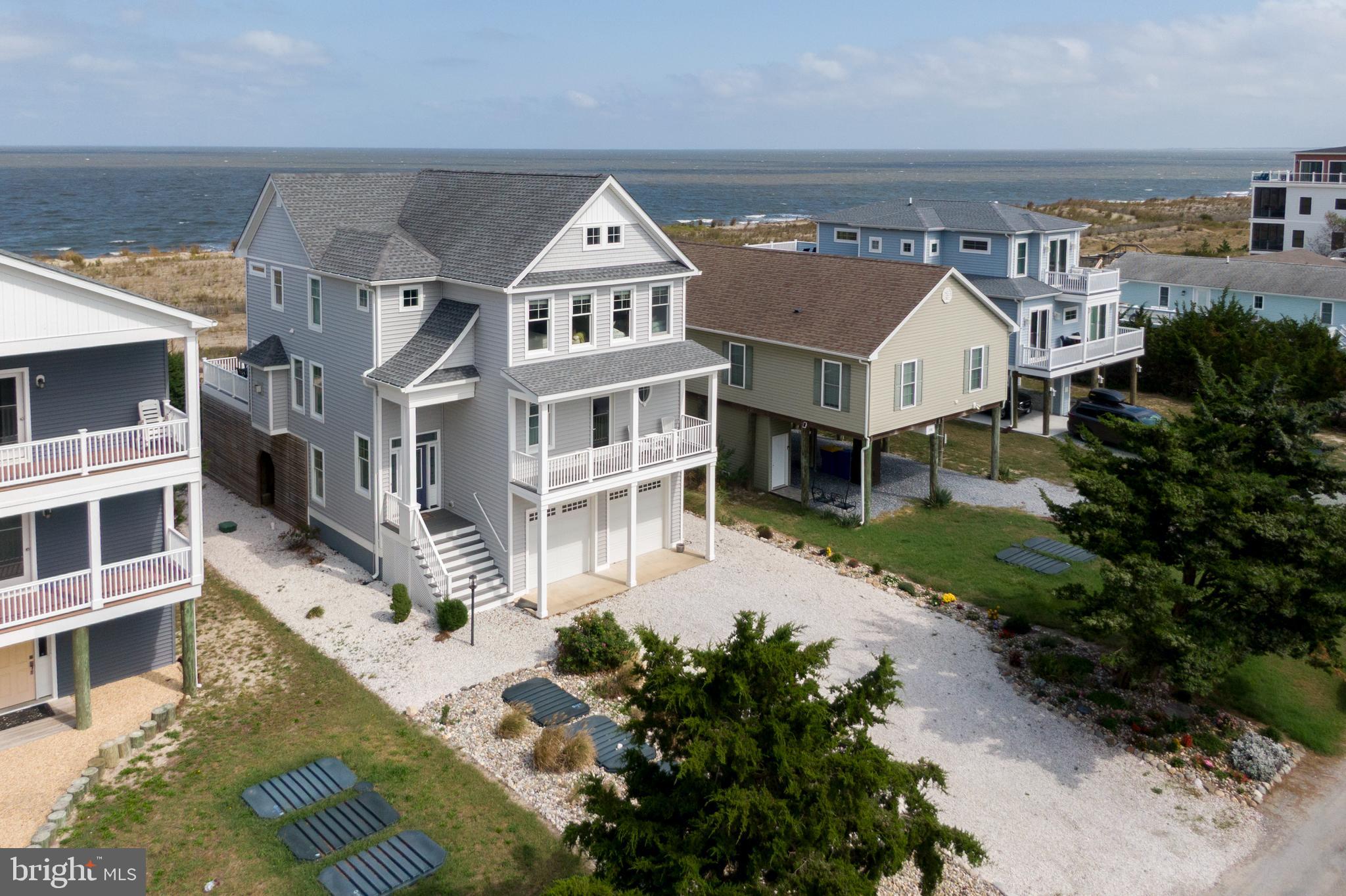 Luxury Coastal Living at its finest! This exquisite coastal home boasts breathtaking, panoramic, unobstructed views of the Delaware Bay, as well as tranquil views of the Prime Hook National Wildlife Refuge. A winning combination in the very sought after beach community of Broadkill Beach.
This stunning custom-built home features four bedrooms, 2 of which are master suites, and three and one half baths with a two car attached garage. The oversized garage offers loads of storage. The driveway accommodates ample parking. Behind the garage is an enclosed storage area for your watercraft/beach supplies.  There is also a shed for extra storage and an outside shower.
The state of art elevator accommodates easy access to all levels of the home. The main area boasts an open floor plan with spectacular panoramic views of the Delaware Bay. Cozy up on chilly evenings in front of the beautiful marble fireplace with huge tv and surround sound.
The chef's kitchen is an entertainer's paradise with five burner gas stove top, large drawer microwave, built in wine racks, glass front cabinets to name just a few upgrades. Entertain your family and friends at your ten plus seating island as well as your large dining table for large gatherings.
Enjoy your after-dinner libation on the 16 X 29 spacious deck off your family room, accessing your private walkway to your private beach, for sunsets and star gazing, the truly natural beauty of Broadkill Beach.
Upon your return from the beach, the second floor offers one of the two master suites with a 2 X 5 private balcony.  Enjoy the soaking tub overlooking the Prime Hook Wildlife Refuge.  This master suite offers two large walk-in closets. 
The third floor includes three additional bedrooms, one being the second master suite. The second master suite affords you another soaking tub and a balcony with those never ending sunsets on Delaware Bay. 
Last but not least the third ( hallway) bathroom doesn't fail with a tub and shower.  All bedrooms have walk in closets. 
Don't miss this opportunity of a lifetime to own your coastal dream home on Delaware Bay.  This is also a great rental investment.  
WELCOME HOME!!!  Let the precious memories begin.  Completely furnished move right in!