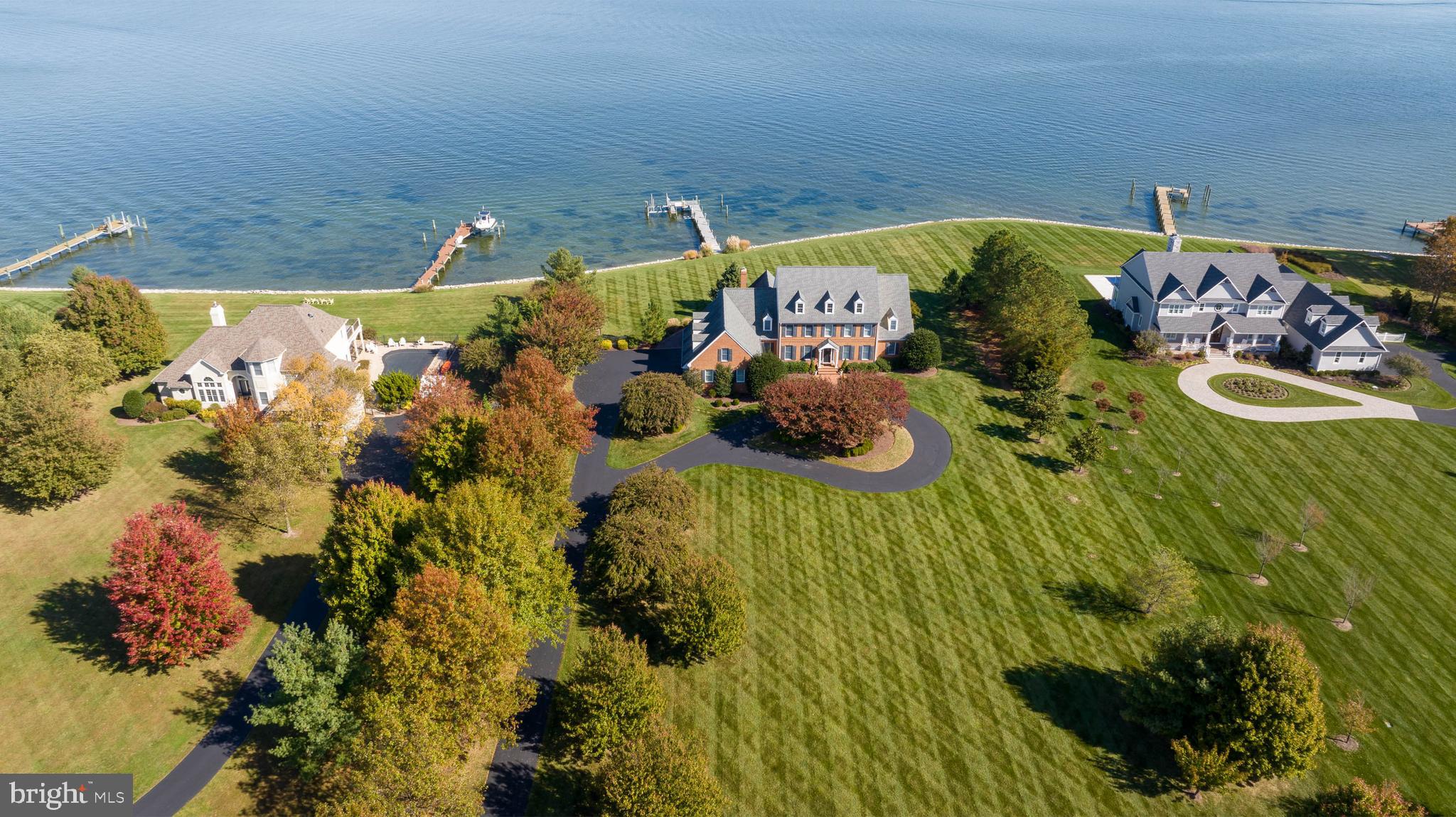 Rare opportunity to acquire a well-appointed home with immense views and convenient proximity to St Michaels.  Ideally located by land and sea in Chance Hope Farm on the Miles River at the confluence of Eastern Bay, this stunning, classic eastern shore brick colonial has everything the most decerning buyer needs.  This Daffin custom-built home features a generous, main-level primary suite featuring a spa-like bath with heated floors, a large soaking tub and separate shower, and two walk-in closets. The kitchen is a chef’s dream, featuring high-end stainless-steel appliances, a wine cooler, a warming drawer, and a massive island. There are also formal living and dining rooms, two office spaces, a recreation room, and a river room that enjoys views of Eastern Bay and beyond.  The park-like lot has 220+/- feet of rip-rapped shoreline, a private pier with 3’ of MLW, lush landscaping, and a waterside deck with an outdoor kitchen.