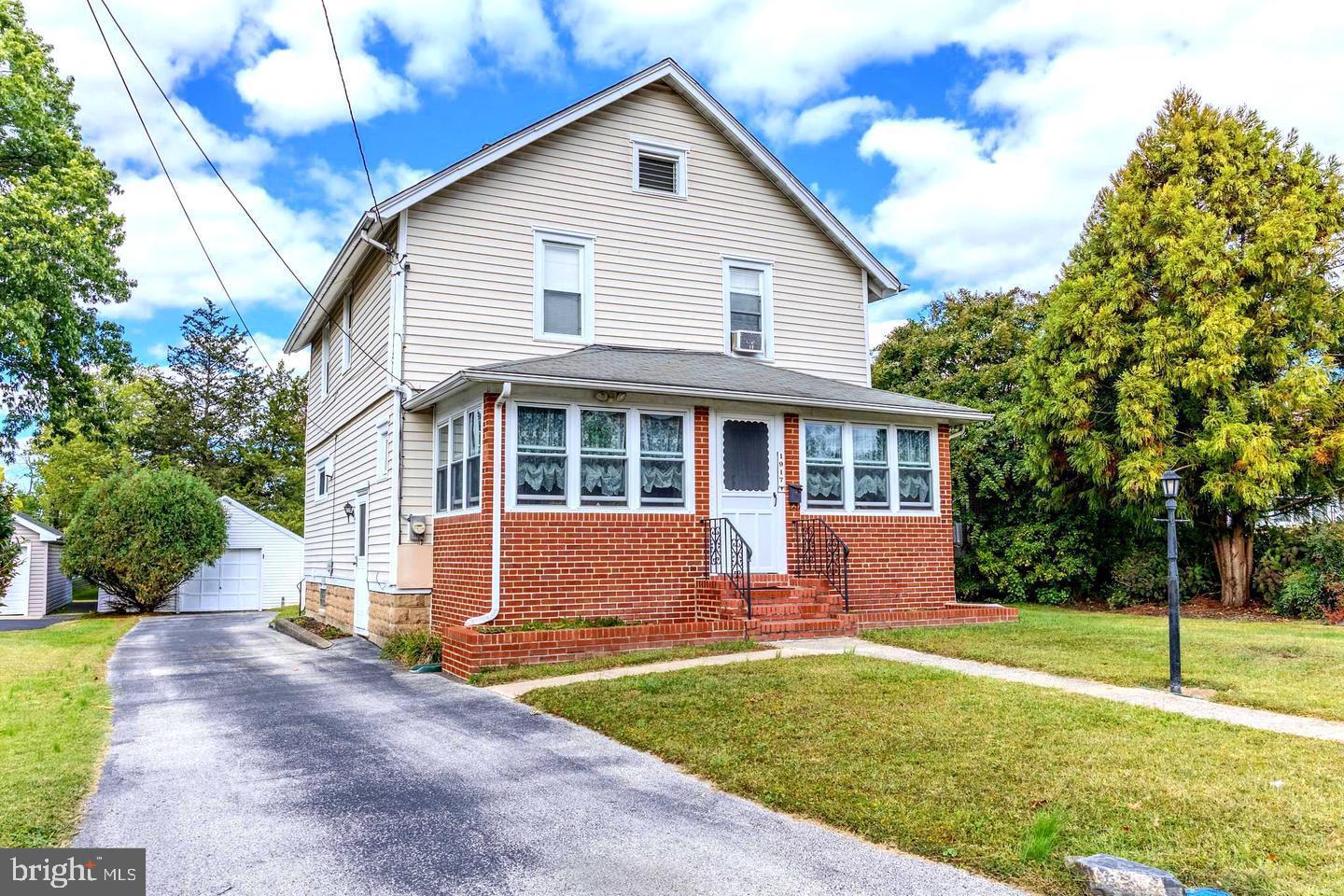 Welcome Home! Nestled on a quiet street, this well-maintained home with a lot of warmth and pride of ownership. This 2-story home offers a wonderful blend of classic charm, comfort, and thoughtful updates. Step inside to the warm and inviting feel, featuring some hardwood flooring, ceiling fans, and spacious living areas designed for everyday enjoyment. The remodeled kitchen, approximately 10 years young, offers solid wood cabinetry, luxury plank flooring, generous natural light, and a practical layout for cooking and gathering. This lovely home features 3 bedrooms, 1 full bath, and 2 half baths, providing comfortable space for bedrooms, guests, a home office, or hobbies.  New steps to the attic. The finished basement expands the living space and is perfect for relaxing or entertaining, complete with a cozy bar area, French drain, and sump pump with battery backup for added peace of mind. Enjoy the enclosed front porch, offering a charming spot to sit, relax, and unwind. Out back, your private fenced retreat awaits with 6-foot vinyl fencing installed in 2006, a sparkling chlorine inground pool ranging from approximately 3.5 to 10 feet deep, with the pool motor replaced 2023,  new timer for pool 2026and a lovely brick garden area. This outdoor space is ideal for summer gatherings, outdoor dining, gardening, or simply enjoying your own backyard oasis. Additional highlights include a replaced roof, replaced gutters,replaced oil heater with hot water summer/winter hookup, 200-amp electric service, 4 window A/C units, a detached garage, resurfaced  and recoated driveway with room for 4 cars, and more. Conveniently located close to shopping, public transportation, and many local amenities, this home truly reflects pride of ownership and is ready to welcome its next owner!