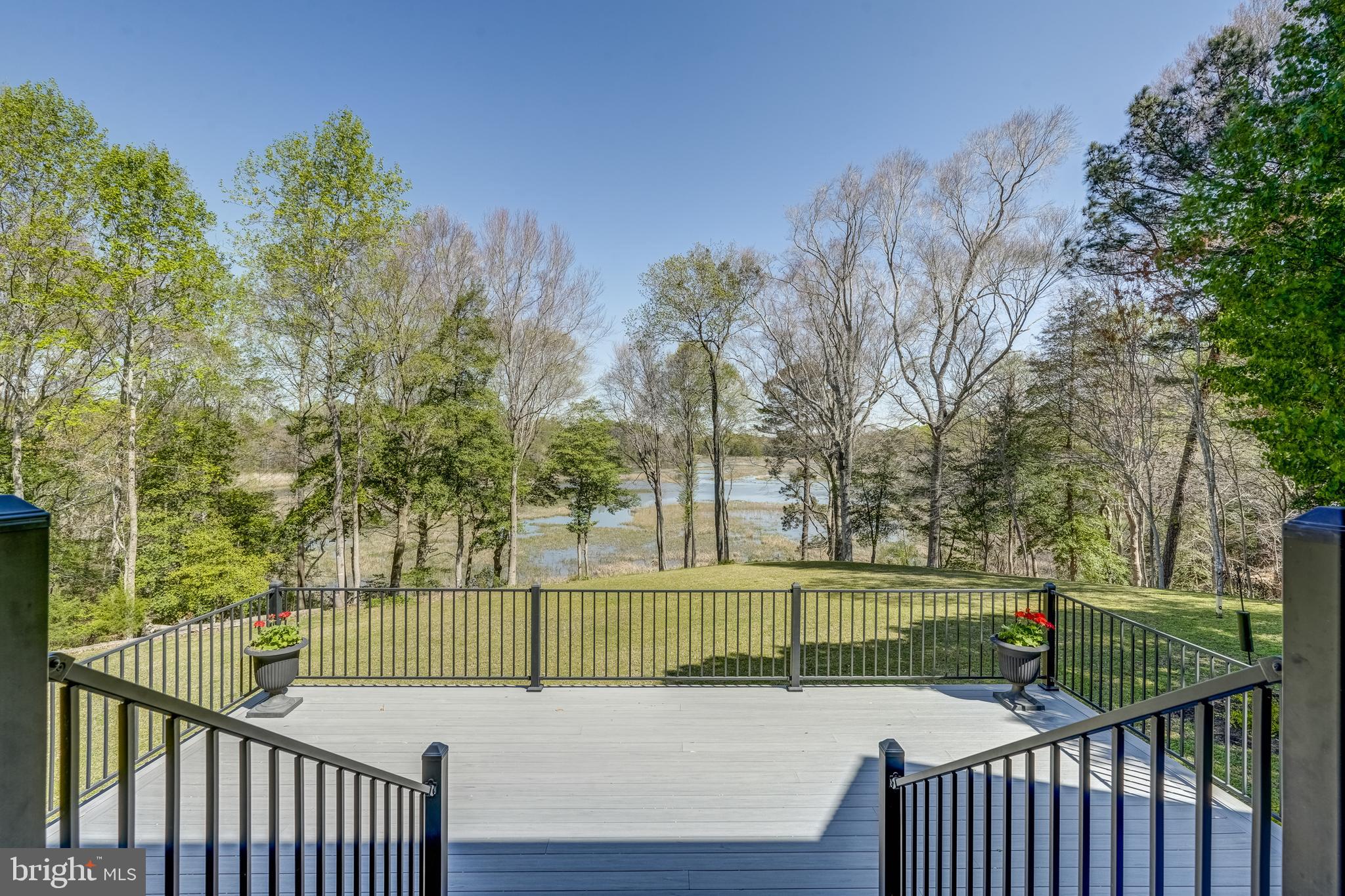 Chippokes Creek Waterfront Home - truly a hidden gem! Nestled on 14 acres along Chippokes Plantation State Park, you will enjoy living in this stunning home and the peaceful, waterfront lifestyle it offers. Whether admiring the spectacular views from the back deck or paddling a canoe down the creek, there is something for everyone! A short drive to the Ferry or to downtown Smithfield, this home combines tranquility with easy access to local amenities.  Property features include a first-floor primary suite with comfortable one-level living, vaulted ceilings, bamboo flooring, expansive views, spacious second floor bedrooms, 3 car garage, and additional rooms well-suited for a home office or fitness center.  Owner updates include a remodeled kitchen complete with leathered granite, 5 burner gas stovetop, built-in cabinets with glass doors, and expanded back deck.   This home is a great place to get away from it all!