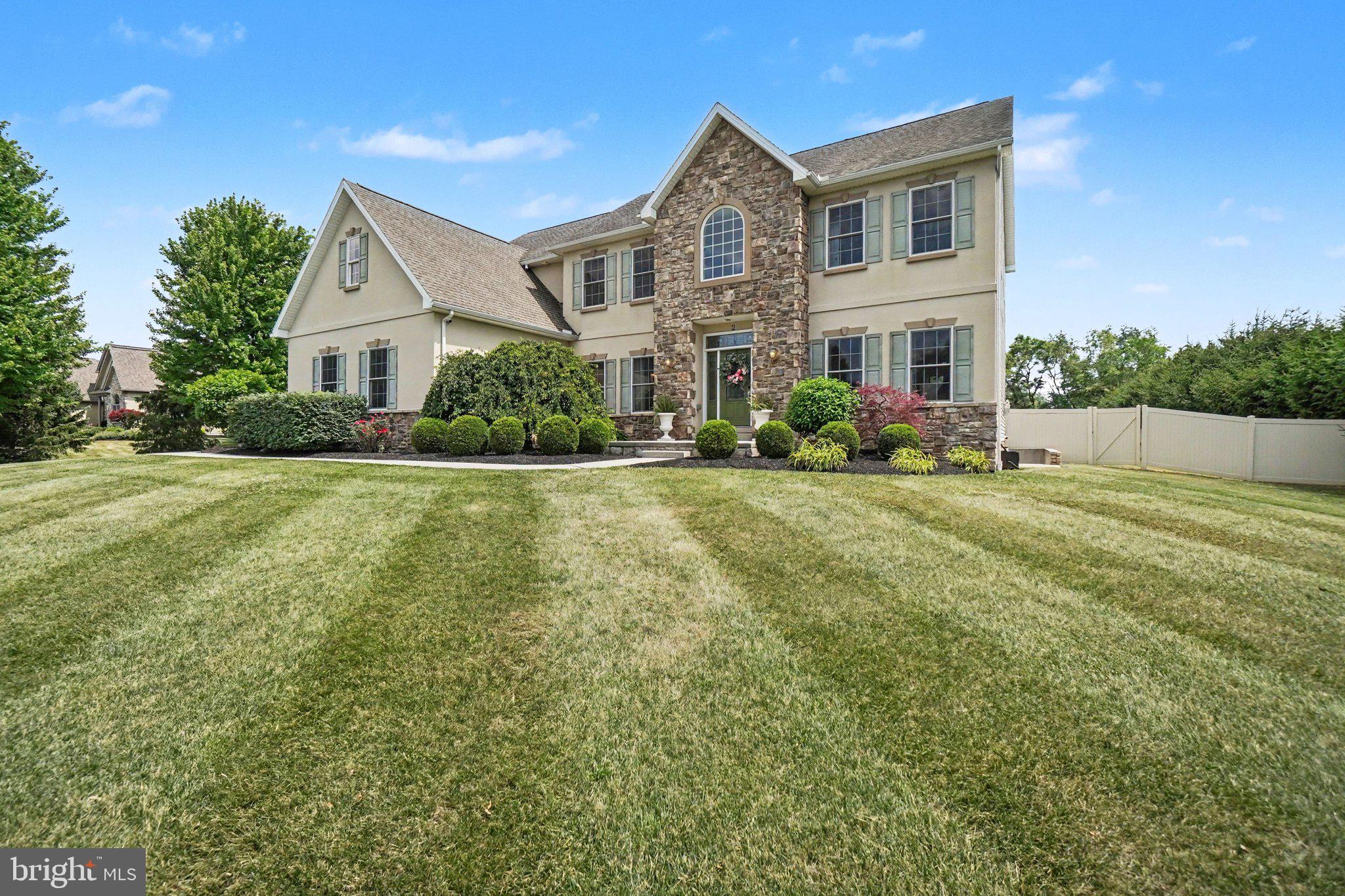 Nestled on 2.26 private acres and ideally situated between the Carlisle Pike and vibrant Downtown Carlisle, this exceptional property in the Cumberland Valley School District offers the perfect balance of peaceful seclusion and everyday convenience.
A long, impressive driveway welcomes you to this timeless 4-bedroom, 3.5-bath home, complete with an attached three-car garage. Step inside to a grand foyer highlighted by an oversized Restoration Hardware crystal chandelier, setting the tone for the elegant yet inviting interior.
Designed for both comfortable everyday living and effortless entertaining, the main level features a beautifully updated eat-in kitchen with an oversized island, new countertops, and an open flow into the warm family room with a cozy fireplace. A formal dining room, private office, powder room, mudroom, and versatile bonus room—ideal as a walk-in pantry, hobby room, or additional storage—complete the thoughtfully designed first floor.
The second level offers a luxurious primary suite with a spacious sitting area, an enormous walk-in closet, and a spa-inspired bath featuring a soaking tub and separate tiled shower. A private guest suite with its own en-suite bath, along with two additional bedrooms connected by a Jack-and-Jill bathroom, provides exceptional space and privacy for family and guests.
The backyard is truly the centerpiece of this remarkable property. Fully fenced and designed as your own private retreat, it offers the feeling of a luxury vacation destination right at home. The sparkling in-ground pool with waterfall has been enhanced with a modern sun shelf, creating the perfect place to relax and unwind. A hot tub, wooden swing set, and expansive lawn provide endless opportunities for entertaining, recreation, gardening, or simply enjoying the peaceful surroundings.
Combining timeless style, generous living spaces, and an incredible outdoor oasis, this one-of-a-kind property offers a rare opportunity.