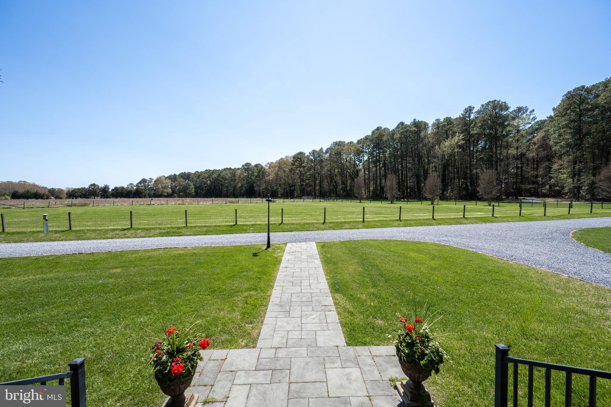 Set on 19.5 private acres just minutes from historic waterfront Saint Michaels, this exceptional 4,492 sq ft residence offers the perfect blend of space, privacy, and convenience.  The home features four bedrooms and two and a half baths, with expansive living areas ideal for both everyday living and entertaining, including a well-appointed chef's kitchen.  The thoughtfully designed layout includes a designated space for a future elevator, adding flexibility and long-term convenience. A separate car barn provides ample storage for vehicles, hobbies, or workshop space.  Enjoy the nicely fenced rear patio area, perfect for outdoor relaxation or entertaining.  Surrounded by peaceful countryside yet close to the charm, dining, and waterfront attractions of downtown Saint Michaels, this property presents a rare opportunity to enjoy Eastern Shore living at its finest.
**Note the forest area behind the house has been put into the DNR's Forest Stewardship Plan which allows the home owner to keep the AG tax discount without having to grow crops and/or livestock.