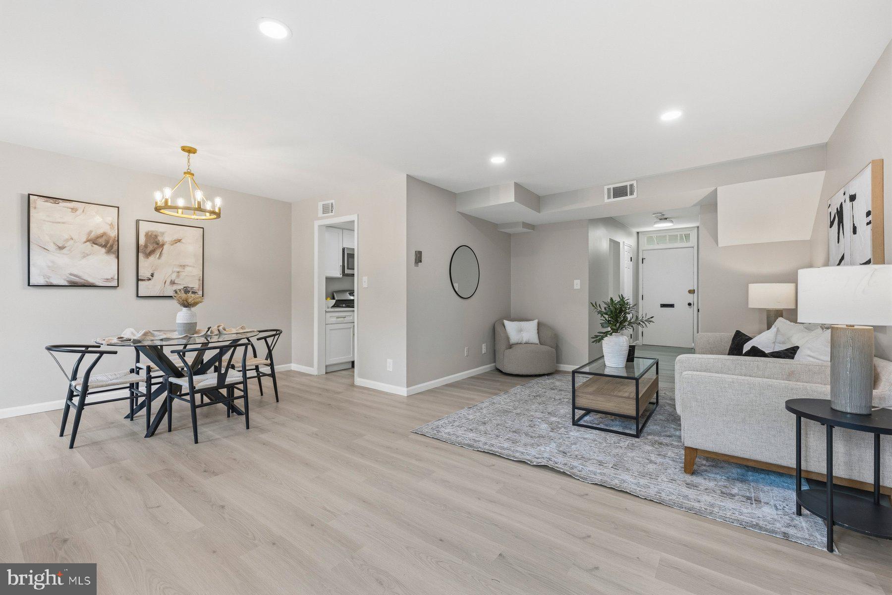 Welcome home to this beautifully renovated 3-bedroom, 2.5-bath townhome-style condominium in the desirable Woodside Village community. Thoughtfully updated from top to bottom, this move-in-ready home features modern finishes, brand-new flooring and carpet, stylish fixtures, and a bright open layout designed for today's lifestyle. The updated kitchen showcases elegant quartz countertops, contemporary cabinetry, and ample prep space, while the oversized windows and expansive balcony door flood the home with natural light throughout the day. Enjoy seamless indoor-outdoor living with direct access to the private balcony—perfect for morning coffee or unwinding after a long day. Convenience abounds with an in-unit washer and dryer, generous bedroom sizes, and updated baths. The condo fee includes utilities, helping simplify monthly expenses and add value for homeowners and investors alike.

Ideally located just minutes from Metro access, major commuter routes, shopping, dining, and downtown Silver Spring, this home offers the perfect combination of modern comfort, convenience, and long-term value. Whether you're searching for your next home or a smart investment opportunity, this turnkey property is one you won't want to miss.