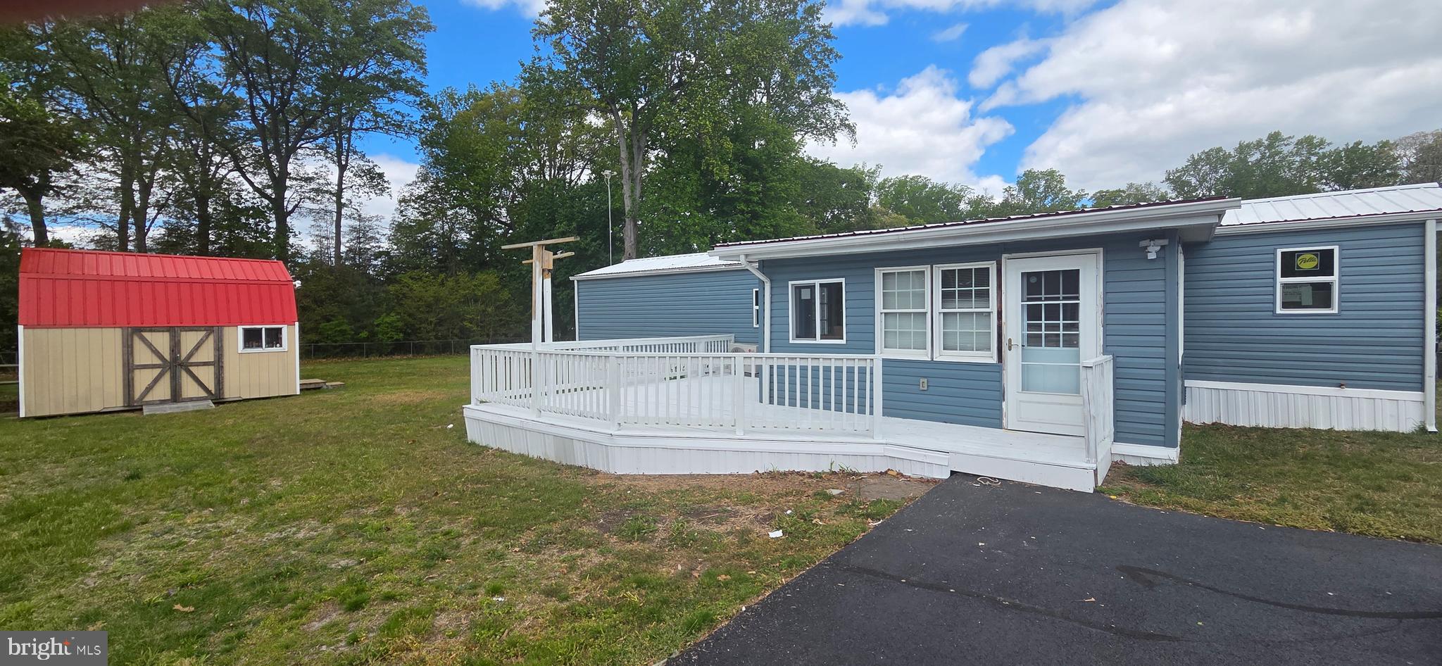 Look no further! Completely remodeled! Nice 2 bed 1 bath single wide with stick built addition located in the quiet community of Angola Crest II. New siding, Pela windows, appliances and flooring just to name a few of the improvements on this  property.  Large lot to kick back on with an ample sized shed/ workshop with electric perfect for your beach gear and hobbies. Centrally located to both Lewes and Rehoboth.  Short drive to restaurants, shopping and of course the beaches. Perfect for anyone looking for a year round or seasonal home. Relax on the deck with a cocktail or coffee and enjoy the quiet surroundings. Interior is currently under construction. Home being sold as is. Purchase based upon park approval.