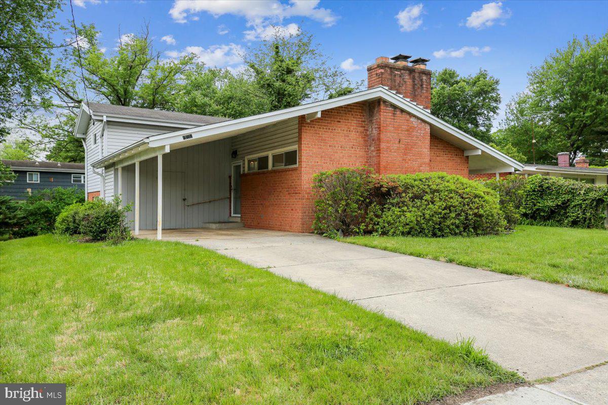 Thoughtfully updated and beautifully maintained mid-century brick contemporary home nestled in the highly sought-after Kemp Mill Estates neighborhood of Silver Spring.
Built in 1958, this home offers four finished levels of comfortable living with four bedrooms, two and a half baths, and over 2300 square feet. Featuring vaulted ceilings, hardwood floors, recessed lighting, and fresh paint throughout.
From the moment you enter, you’re greeted by an inviting foyer that leads into a light-filled living room with vaulted ceilings, recessed lighting, ceiling fan and a striking floor-to-ceiling brick fireplace—perfect for both relaxing and entertaining. This level also offers a versatile bedroom or home office, coat closet and convenient slider to access a charming side patio.  
Just a few steps down, the spacious dining room provides seamless indoor-outdoor flow with a sliding glass door to the backyard and connects easily to the kitchen through a convenient pass-through. The updated table-space kitchen offers abundant cabinetry with elegant under-cabinet lighting, including convenient access from both the kitchen and dining room. It is thoughtfully equipped with stainless steel appliances, a pantry, and recessed lighting—creating a space that is both functional and inviting. Adjacent to the kitchen, there is a powder room and a laundry room with cabinets, utilities and its own exterior entrance for added convenience.
The lower level features a large family room with a second brick fireplace, recessed lighting as well as a storage room and closet.
Upstairs, there are three bedrooms with hardwood floors, along with two full bathrooms and a large linen closet. The primary suite offers a ceiling fan and a custom built-in wardrobe, creating a comfortable retreat.
Outside, enjoy a level lot that’s ideal for outdoor living and entertaining. A carport adds everyday convenience with a built-in shed for additional storage.
Ideal central location within the neighborhood and positioned on a quiet street, this home offers easy access to shopping, restaurants, public transportation, commuter routes, and houses of worship—making it a perfect blend of comfort, convenience, and community.  Welcome home!  
Recent upgrades and improvements include: All ages are approximate: Fresh paint throughout – 2026, Shampoo carpet – 2026, Hot water heater – 2024, Air conditioner & furnace – 2014, Windows replaced (except well windows) – 2006, Siding – 2006, 40 year asphalt shingle roof – 1994.