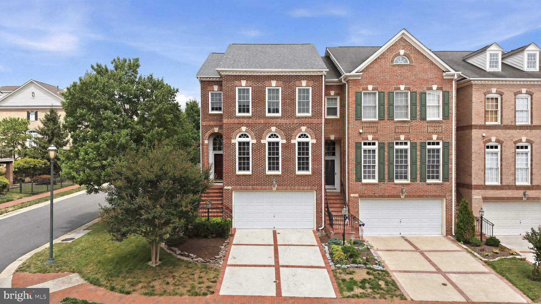 Prime End-Unit in the Prestigious Bear Creek Section of River Creek!

Perfectly situated on a beautifully landscaped premium end-unit lot, this exceptional townhome offers an ideal blend of elegance, comfort, and an unbeatable location within one of Loudoun County's most sought-after gated communities. Recent improvements include a brand-new roof (2026), fresh custom paint throughout, beautifully refinished hardwood floors on the main level, brand-new carpeting, and a newly refinished deck—making this home truly move-in ready.

The inviting main level showcases gleaming hardwood floors throughout the foyer, dining room, hallway, family room, kitchen, and powder room. A spacious open-concept layout seamlessly connects the dining room, family room, and kitchen, creating the perfect setting for both everyday living and entertaining.

The well-appointed kitchen features abundant cabinetry, a generous pantry, upgraded stainless steel appliances, and a center island with convenient pull-out shelving and seating—ideal for casual meals or enjoying your morning coffee. The adjoining family room allows you to stay connected with family and guests while preparing meals.

Step outside onto the newly refinished full-size deck, providing an outstanding extension of the living space for outdoor dining, entertaining, or simply relaxing while enjoying the beautifully landscaped surroundings.

Upstairs, you'll find three generously sized bedrooms, two full bathrooms, and the convenience of an upper-level laundry room. The spacious primary suite offers a tray ceiling, ceiling fan, and oversized windows that fill the room with natural light. The luxurious primary bath includes a dual-sink vanity, soaking tub, separate shower, and private water closet.

The finished lower level offers exceptional versatility with a spacious recreation room featuring a cozy gas fireplace flanked by custom built-in bookcases. There's also ample space for a home office, reading nook, or fitness area, along with direct access to the attractive stone patio accented with brick trim.

The oversized garage provides valuable additional storage, including a convenient storage area beneath the front steps—a rare and practical feature.

Residents of the exclusive River Creek community enjoy resort-style amenities including a championship golf course (membership available separately), gated entry, multiple swimming pools, tennis and pickleball courts, basketball and volleyball courts, scenic walking trails, playgrounds, picnic areas, kayak and canoe storage (available for rent), and a launch dock on Goose Creek with access to the Potomac River.

This is a wonderful opportunity to enjoy luxury living in one of Northern Virginia's premier gated communities.