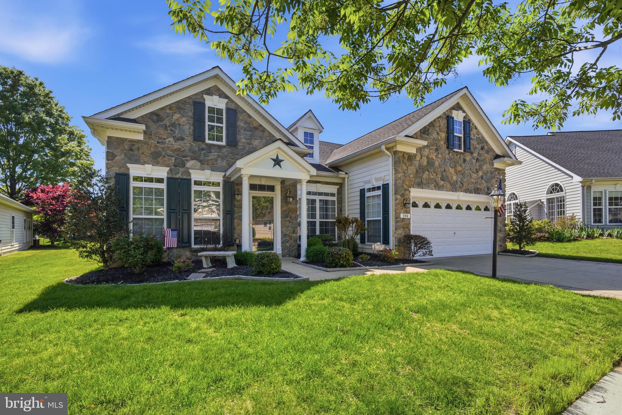 Welcome to effortless luxury in this beautifully maintained move-in-ready home located within a highly desirable 55+ resort-style community. From the moment you step inside, the high ceilings and custom architectural details elevate the entire space creating an atmosphere of refined elegance. The beautiful thoughtful layout maximizes comfort and convenience, allowing you to live effortlessly. Gleaming hardwood floors flow seamlessly through the main living areas, which feature two spacious bedrooms and two-and-a-half pristine bathrooms. Enjoy access to top tier community amenities while relaxing in a home crafted with unmatched care and quality.
Recent care: Roof-late 2022, water heater replaced 2025; heat pump replaced 2022; updated appliances, coated garage flooring; gutter guard, finished sky basement.
 The Symphony Village community is well established, with mature trees throughout, and an impressive clubhouse with many amenities, including a concert hall for the many events organized by the various committees. The main gathering area is bright and welcoming, and is the location for semi-monthly social hours where you bring a dish to share and get to meet your neighbors. Several groups with varied interests meet in the clubhouse on a regular basis, and you might walk through the clubhouse and see folks learning to paint in the craft room, others playing pool, some playing mahjong in the concert hall, or committee meetings to keep things humming along. You can walk outside to the covered patio area and the pool beyond, where residents enjoy holiday picnics, quiet evening time, and fun with the kids during the day. The indoor pool is open every day from early morning until late at night, and you can show up for water aerobics every weekday morning at 9:00A.M. Currently there are Spanish classes offered, in addition to soul line dancing, and at any time you can learn how to play bridge or hand and foot, so there is plenty to keep everyone busy. However, there is no requirement to participate in any activities, and you can live a quiet life in Symphony Village enjoying retirement or still working. There are many areas to walk in around the neighborhood, and in the clubhouse grounds is a pergola to sit and  watch the world go by, a kids' playground, a picnic area, bocce, a putting green (and active league) and a trail leading to Dunkin' Donuts and the shopping center just minutes away.