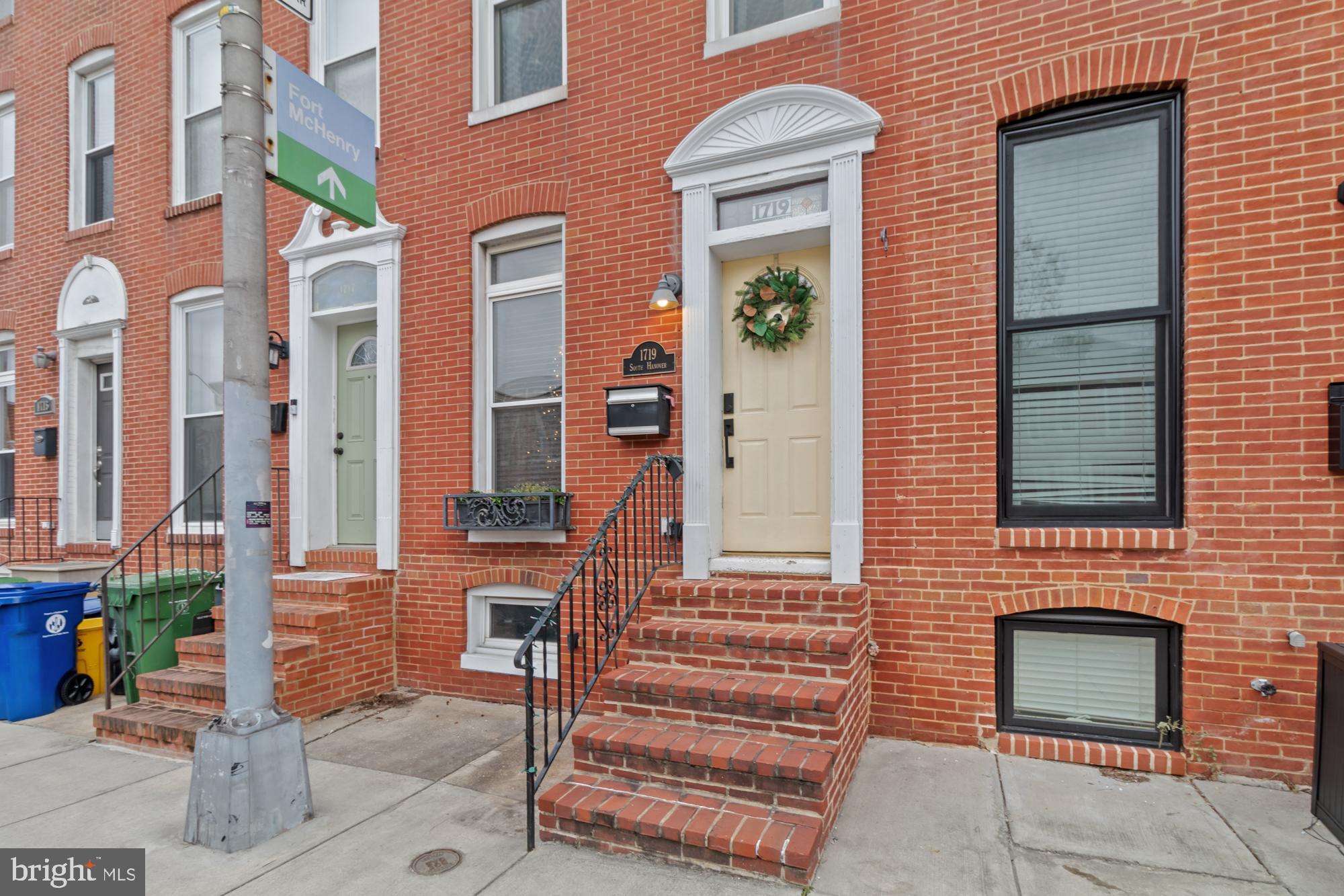 Come see this beautiful Federal Hill townhouse today! Living room with original brick accent wall, dining area. Upgraded kitchen with stainless steel refrigerator, island, & breakfast bar. 1st floor laundry and 1/2 bath. Upper levels each with bedroom and full bath and original brick walls. Out back you will find a lovely fenced in patio for entertaining. Make this your home for the holidays!