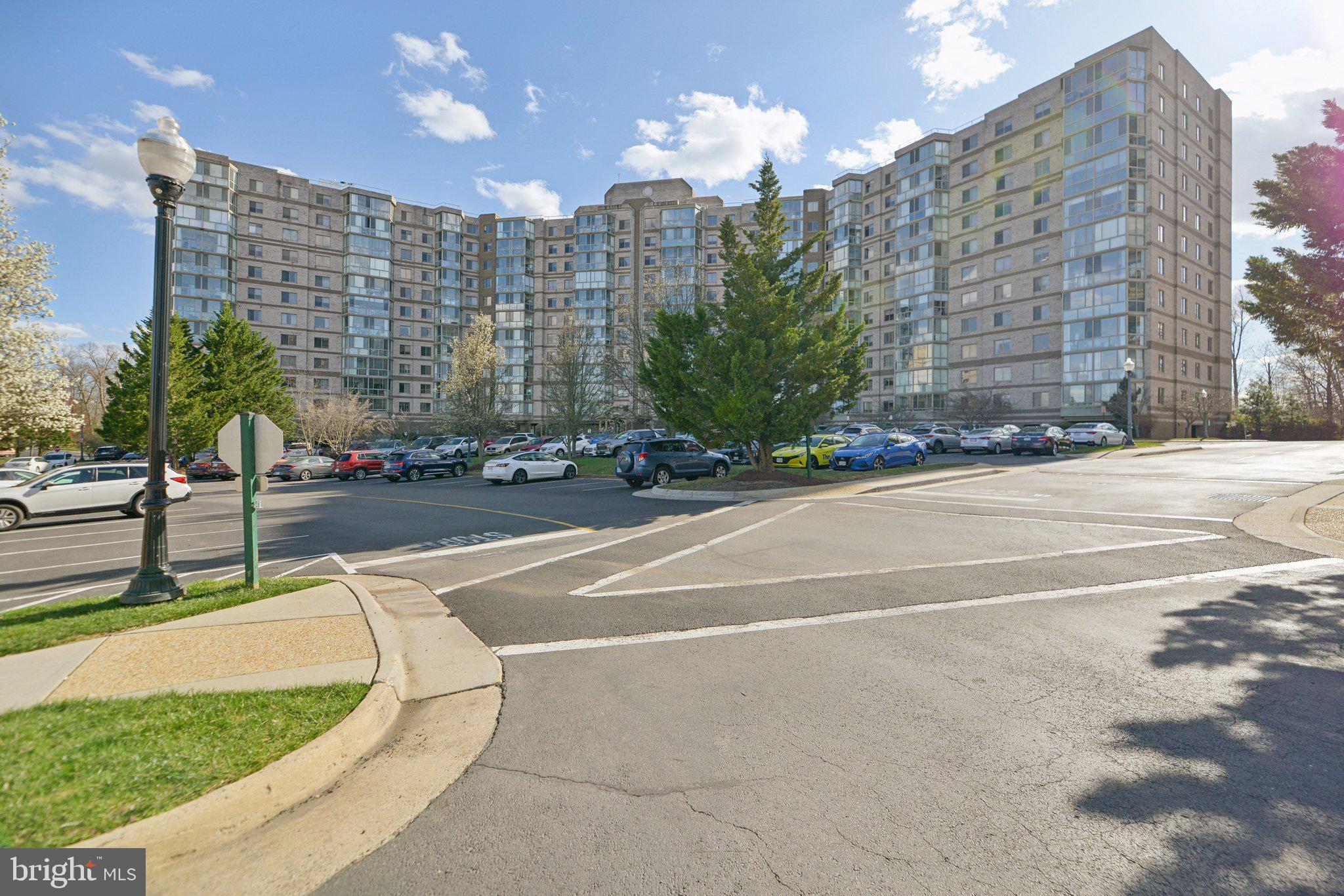 Best value in all of Lansdowne Woods. Lowest price 2 bedroom 2 bath condo. Professionally painted. New carpet. Panoramic view, see the Reston skyline in the distance from the sunroom windows. Amazing floorpan allows flexible furniture arrangements. Large living room, formal dining room with pass through from kitchen. Split bedroom plans for privacy from guests. You will love the glass enclosed sunroom. Blue Ridge is the most social of the Lansdowne Woods communities, with  morning coffee gathering six days a week, drop in Saturday night dinners in the party room, monthly pot luck dinners, gourmet club, Wednesday afternoon tea, and so much more. And yet, many residents enjoy quiet solitude, and blissful privacy. The ideal over 55 condo. The Lansdowne Woods Clubhouse has an indoor salt water pool, gym, dance studio, pottery, a wood working shop with state of the art machinery, art studio, library, chapel, tennis and pickel ball, and quiet areas for chess and checkers. You have an EV? Chargers are in the Clubhouse parking area. Ask your agent for the latest community calendar of activities. Possible VA loan assumption at 2.5% fixed rate, $250,000 balance. Sellers are researching whether to allow assuming this loan, so be sure to ask for the latest details. Condo fees: There are five parts to the Lansdowne Woods condo fees: 1) the HOA fee for the Clubhouse, beautifully landscaped campus, security, etc. $202.00  2) HVAC maintenance plan $19.01 ; 3) Comcast xFinity cable tv and high speed internet and the hardware for both cable and the wireless router $67.96; 4) the condo fee for the condo building you live in $457.90 for this condo; and 5) a monthly amount for an indoor garage space, if your unit has an indoor garage $23.41. The monthly fees are somewhat different in the different condo buildings. But for convenience, residents pay these fees bundled into one monthly payment, usually on autopay, and the community management splits your monthly payments into those four or five parts. If you are not familiar with Lansdowne Woods, the seven communities are: Blue Ridge, Potomac Ridge, Riverbend, Riverview, the Magnolias, the Overlook, and the Vistas. Each has their own management to foster a sense of community within each. Condo fee total monthly for unit 804 = $746.87