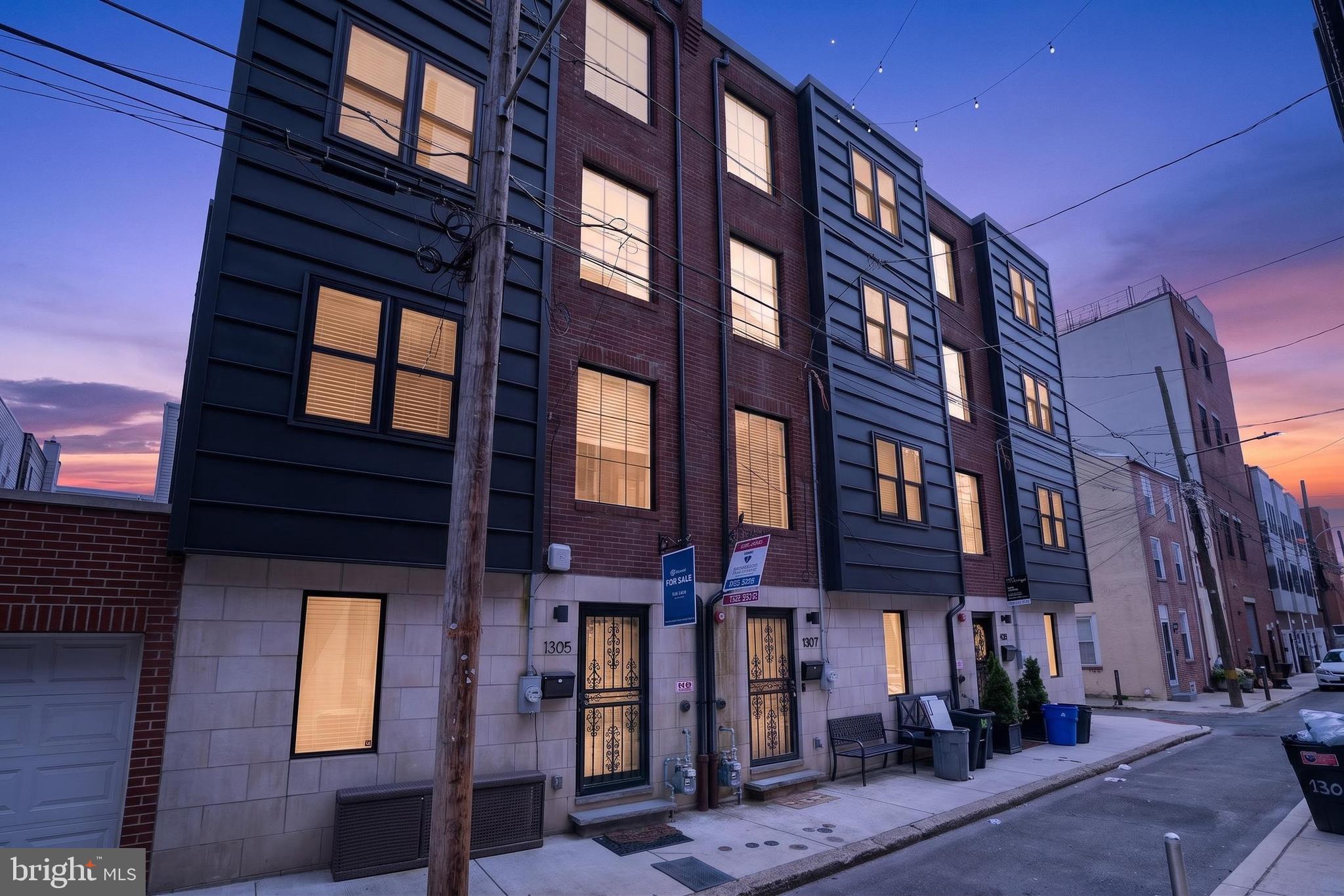Modern 3-level townhouse offering an ideal blend of space, functionality, and city living. The main level features an open-concept layout with a convenient half bath, perfect for entertaining guests. The second floor includes two spacious bedrooms and a full hall bath, the third level also has two bedrooms and a full bath. 
Enjoy stunning views from the rooftop deck overlooking the Philadelphia skyline — the perfect spot to relax or entertain. The finished lower level provides flexible bonus space for a home office, gym, media room, or guest area, and includes inside access to the attached 2-car garage for added convenience.

A rare opportunity to enjoy multi-level living, outdoor space, and city views all in one exceptional home.