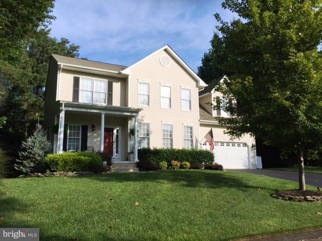 FABULOUS COLONIAL WITH MANY SPECIAL TOUCHES THROUGHOUT. 4 BEDROOM, 2 1/2 BATH, GRANITE COUNTERS, HARDWOOD FLOORS, CUSTOM BUILT-IN BOOKSHELVES, LAUNDRY CABINETRY & MOLDINGS. OPEN FLOOR PLAN W/ GAS FIREPLACE IN LIVING ROOM, SEPARATE DINING ROOM, LARGE KITCHEN W/BREAKFAST ROOM. LG OWNER'S SUITE W/DELUXE BATH. COUNTRY FRONT PORCH, 2 CAR GARAGE, DECK, PATIO AND BEAUTIFUL LANDSCAPING. NICE TREED VIEW!
