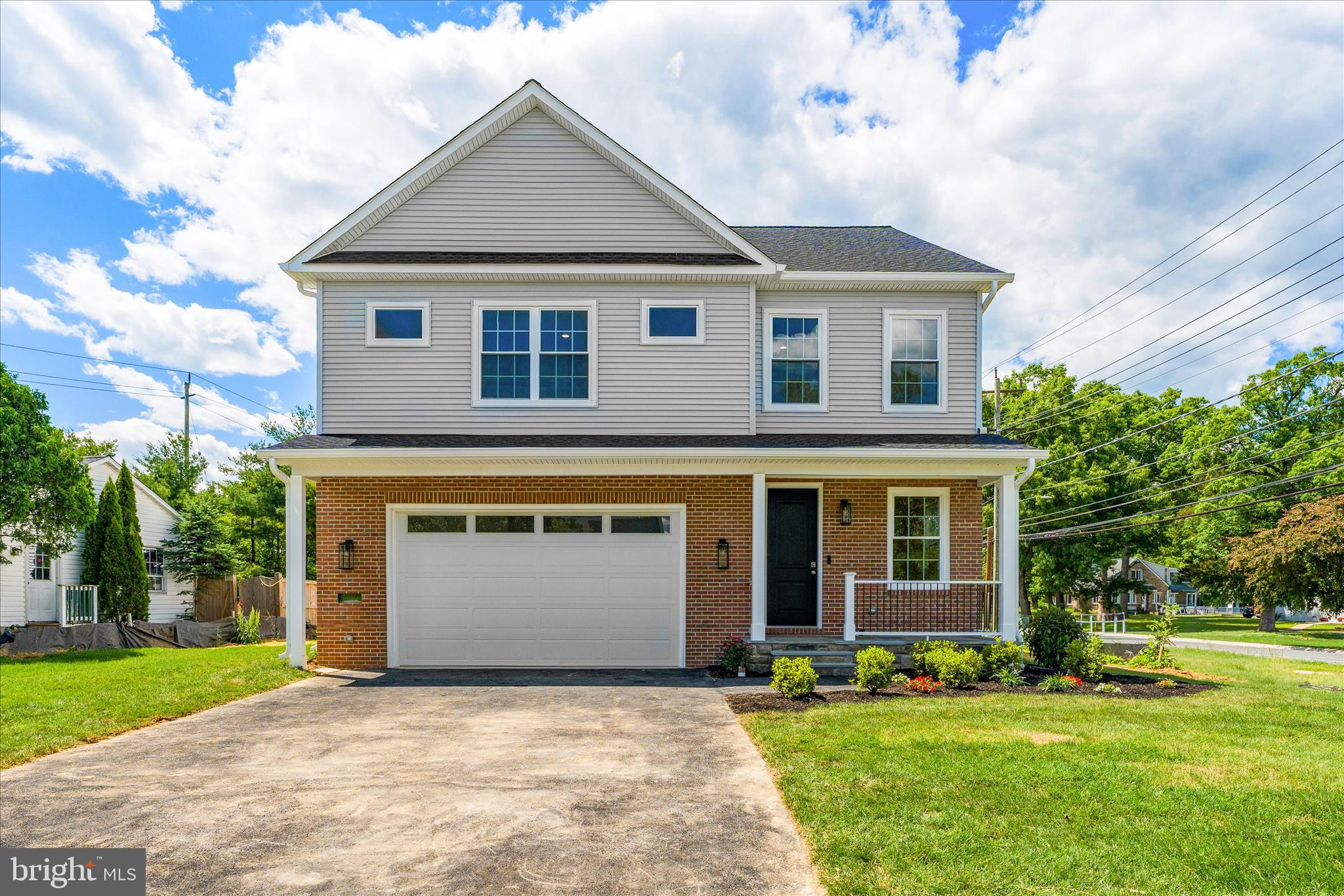 On the market for the first time- a unique opportunity to own a newly constructed home built by the MCPS Construction Trades Foundation! Students in the program cleverly designed and constructed this stunning home under professional supervision.
Where refined modern living meets elevated design, this home blends luxury finishes with everyday comfort for the discerning homeowner. Perched off Cherry Hill Road, this home is just minutes from the ICC, 29, and 95. Shopping is right down the street!  A thoughtfully designed mudroom between the two-car garage and kitchen makes grocery runs easy while offering storage for everyday use
Natural light flows throughout the main level, with an open floor plan and 9' ceilings.  Cozy up to the gas fireplace, enjoy conversation around the kitchen island, or an iced coffee in the sunroom.  
The kitchen  features designer selected finishes including a Brizo faucet, stainless steel appliances, full height backsplash, kitchen island and peninsula. With windows on each side of the home, there are  views of the backyard from every spot in the main living areas... The main floor Powder room feels elevated with a striking Black Onyx faucet and oversized vanity. .


The front living room can serve as a secondary gathering space, office, or  playroom.  Upstairs French doors welcome you into the expansive and luxurious primary en-suite. The primary bath is breathtaking with an expansive vanity, separate walk-in shower, freestanding soaking tub, and private water closet creating a spa-like retreat. A secondary en-suite bedroom features its own adjoining bathroom, making it ideal for guests or in-laws  The third and fourth bedrooms share a well-appointed hall bathroom.. The Laundry Room is conveniently located on the bedroom level, perfectly suited for modern living.
The unfinished basement has a rough-in for a future bathroom, full egress windows and endless potential. Dual-zoned HVACs provide comfort no matter the weather.
Located on a corner lot, there is plenty of room for entertaining both inside and out. The rear of the home features two sliders that open to a deck and backyard.  This is a special chance to own a newly constructed home that is ready for entertainment ,while supporting the program's current and future students!