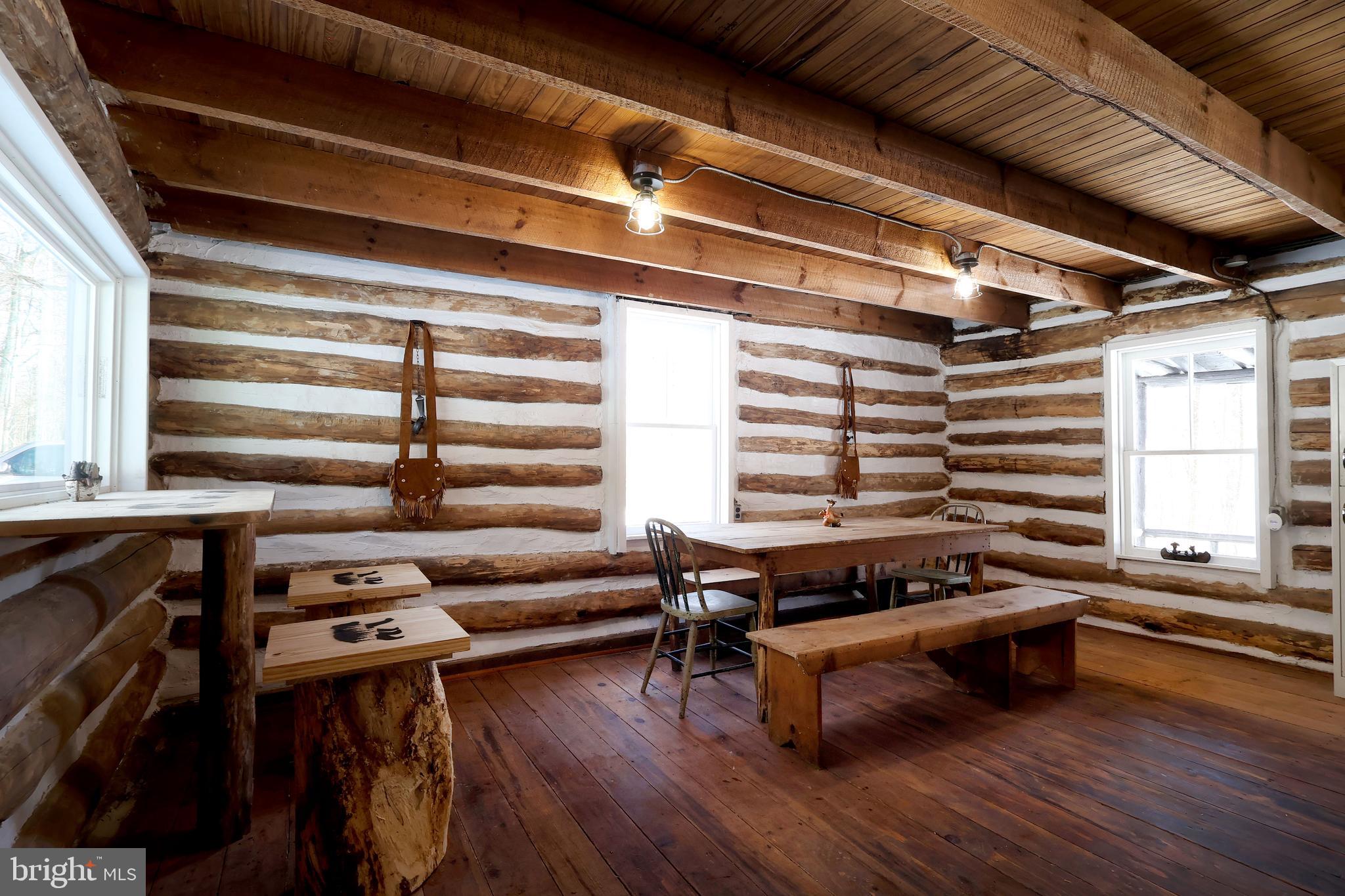 Discover a peaceful escape at 4464 Tram Rd, a secluded log cabin found miles within the Rothrock State Forest in Petersburg, Pennsylvania. This 800 sq ft meticulously restored rustic cabin on leased land is surrounded by thousands of acres of protected land, and is the perfect spot for hunting, hiking, fishing, and many other recreational activities. Inside you can find a newly redone cozy living space with a brand new wood-burning stove with newly put in windows that provide great natural light . The layout also includes a kitchen area, bathroom area, and a great loft area perfect for rest after a long day. Other amenities include electricity and hot water. Outside features a covered porch perfect for relaxation, and a scenery of natural beauty. About 2 miles from the cabin you can find Globe Run Creek, the perfect spot for trout fishing, as well as Blue Diamond Camp and Lake less than 3 miles away. This cabin is also close-by to places like Penn State University, Shaver’s Creek Environmental Center, Whipple Dam State Park, Lake Perez, and Raystown Lake.